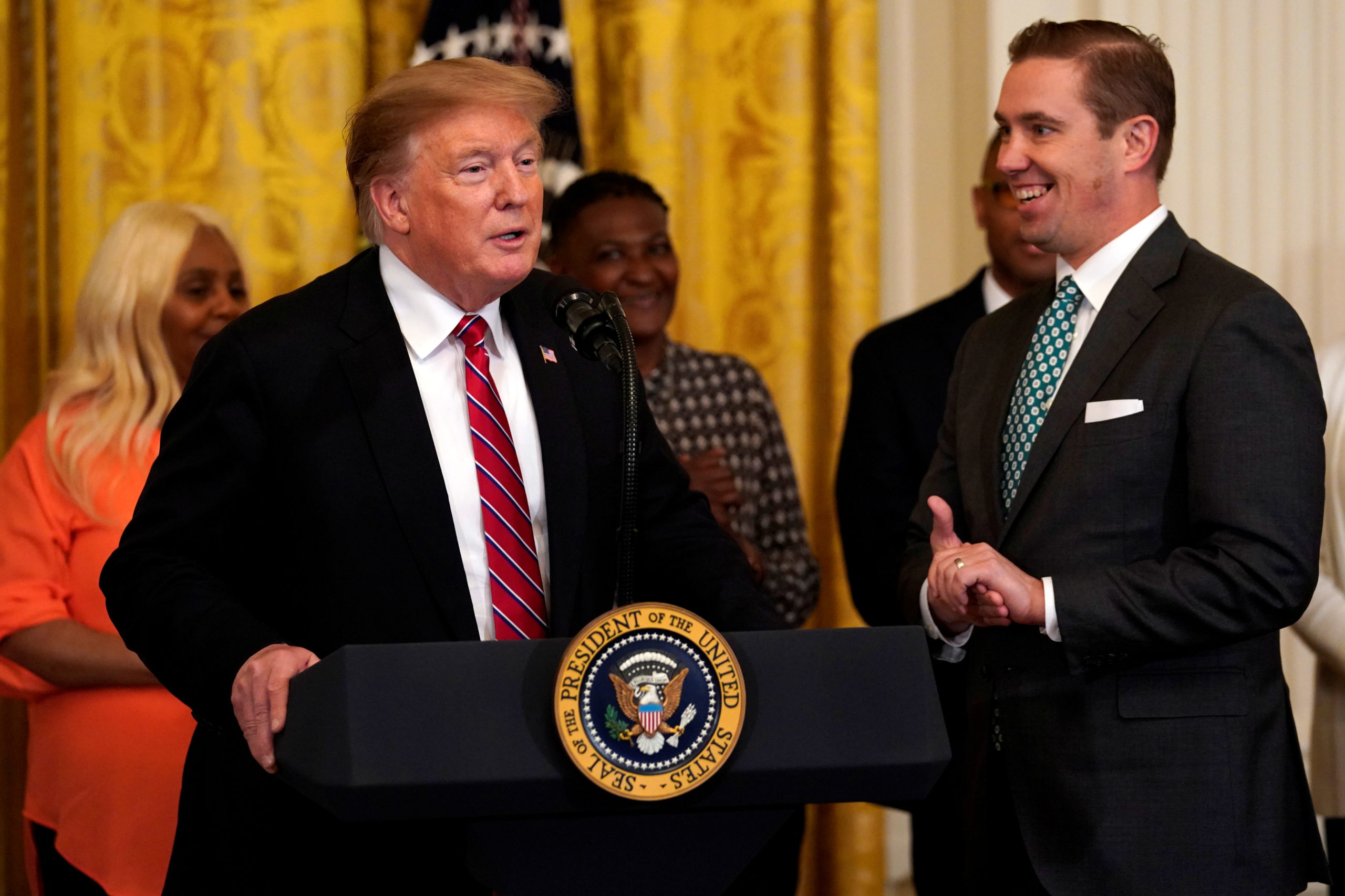 U.S. President Donald Trump speaks next to Shon Hopwood, Georgetown law professor, and convicted felon, who is Tiffany Trump's professor, during the 2019 Prison Reform Summit and First Step Act Celebration at the White House in Washington, U.S., April 1, 2019. REUTERS/Yuri Gripas