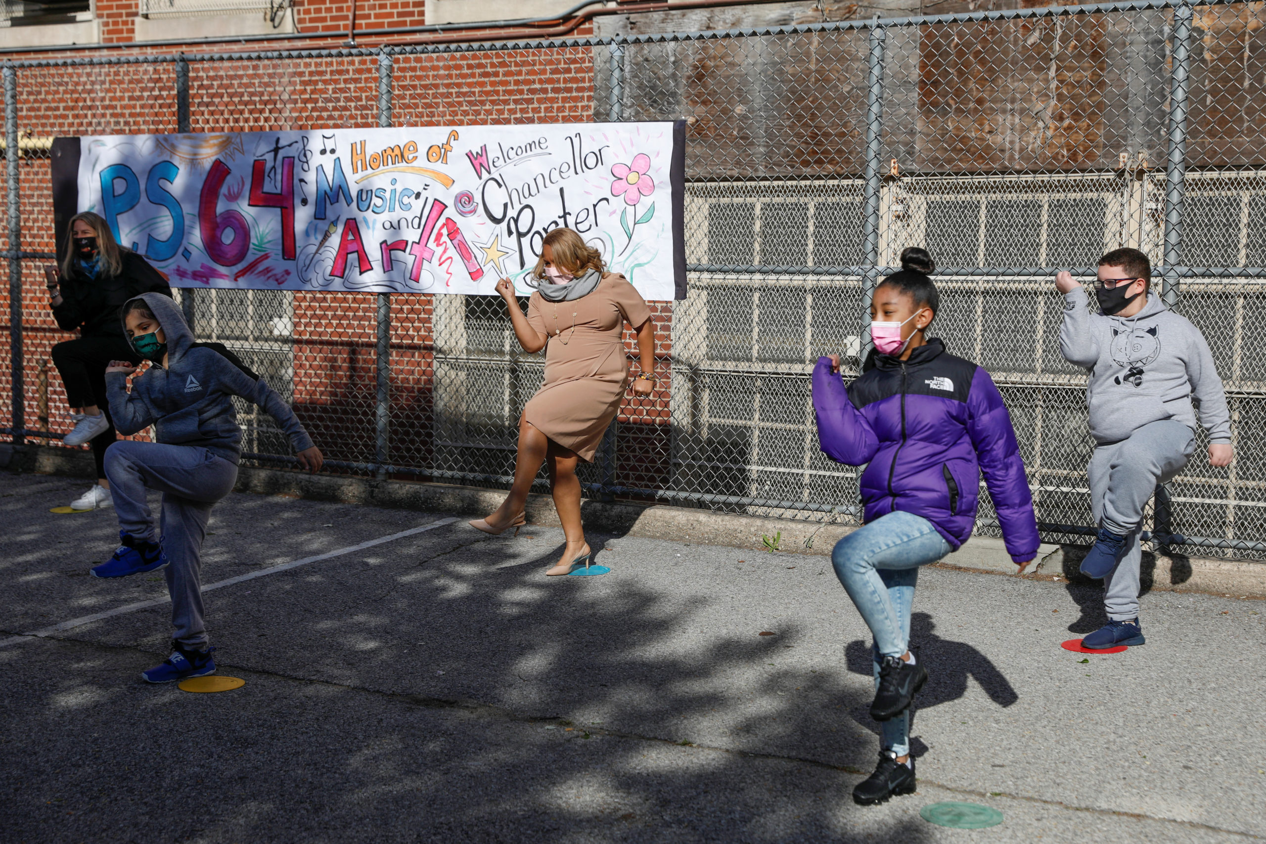 Meisha Porter, Chancellor of the New York City Department of Education, takes part in morning exercises with students as they return to P.S. 064 Robert Simon school during the outbreak of the coronavirus disease (COVID-19) in Manhattan, New York City, New York, U.S., April 26, 2021. REUTERS/Andrew Kelly