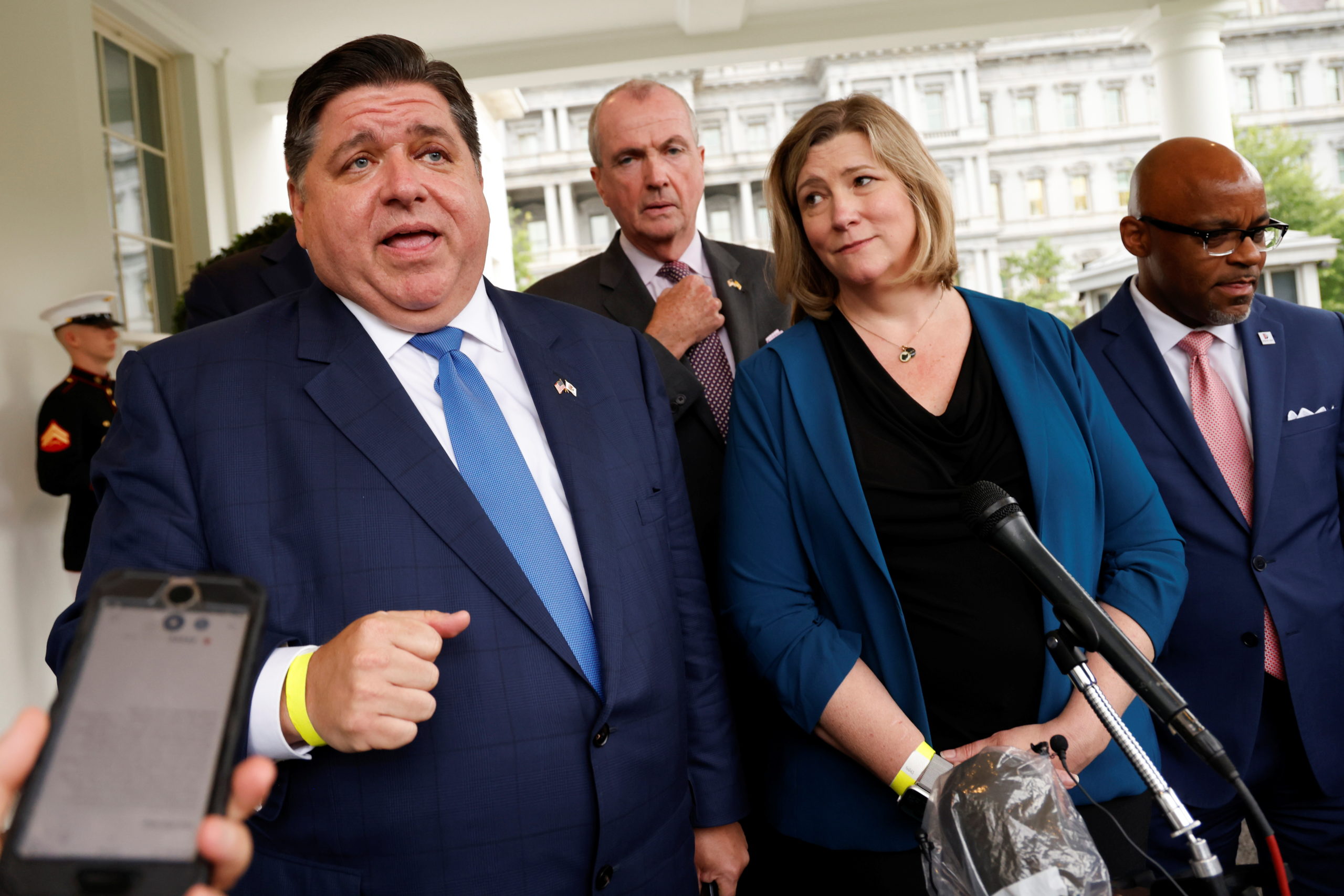 A bipartisan group of mayors and governors, including Illinois Governor J.B. Pritzker, New Jersey Governor Phil Murphy, Dayton Mayor Nan Whaley and Denver Mayor Michael Hancock, speak to reporters after meeeting on infrastructure with U.S. President Joe Biden at the White House in Washington, U.S. July 14, 2021. REUTERS/Jonathan Ernst