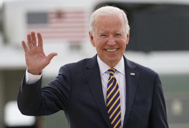 U.S. President Joe Biden waves as he boards Air Force One upon his departure for Cleveland, Ohio, from Joint Base Andrews in Maryland, U.S., July 6, 2022. REUTERS/Kevin Lamarque