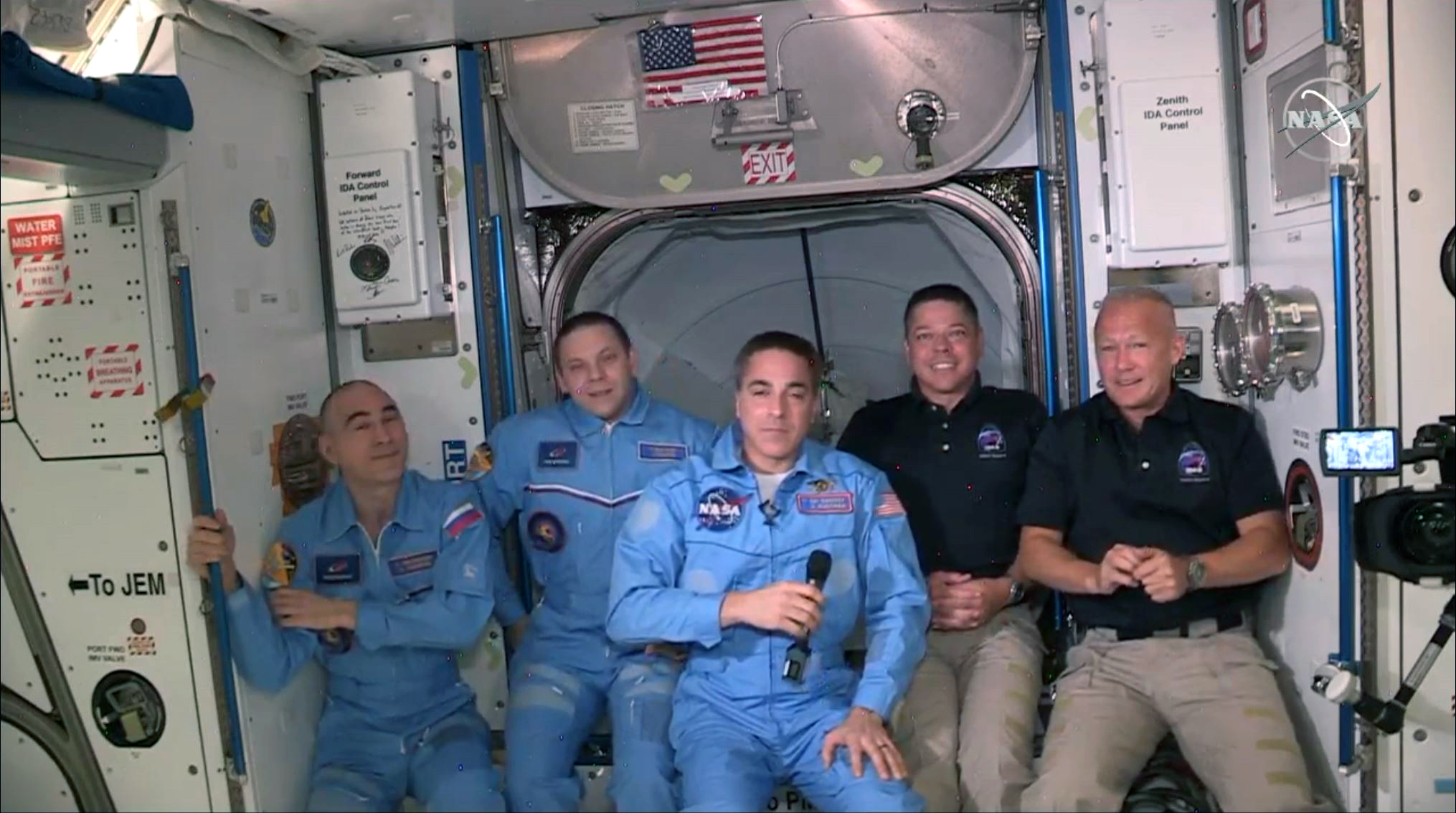 INTERNATIONAL SPACE STATION - MAY 31: In this screen grab from NASA's feed, NASA astronauts Doug Hurley (R) and Bob Behnken (2R) join NASA astronaut Chris Cassidy (C) and Russian cosmonauts, Anatoly Ivanishin (L) and Ivan Vagner (2L) aboard the International Space Station after successfully docking SpaceX's Dragon capsule May 31, 2020. The docking occurred just 19 hours after a SpaceX Falcon 9 rocket blasted off Saturday afternoon from Kennedy Space Center, the nation’s first astronaut launch to orbit from home soil in nearly a decade. (Photo by NASA via Getty Images)