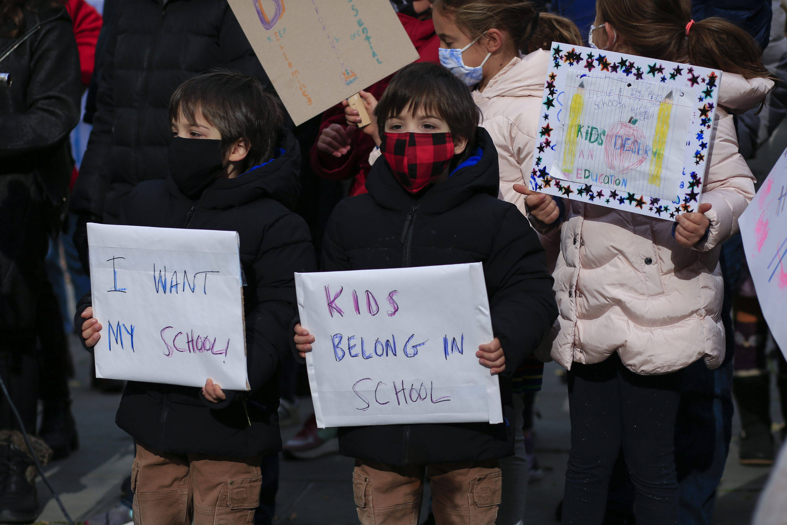 Children take part in a protest demanding that public schools remain open, outside New York's City Hall on November 19, 2020. - US coronavirus deaths passed a quarter of a million people on November 18 as New York announced it would close schools to battle a rise in infections. (Photo by Kena Betancur / AFP) (Photo by KENA BETANCUR/AFP via Getty Images)