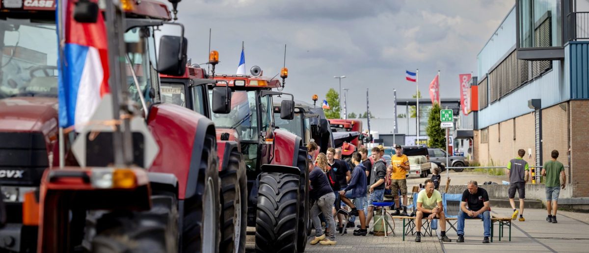 Farmers block the entrance of the distribution center of a supermarket to protest against the government's nitrogen policy in Nijkerk on July 5 2022.