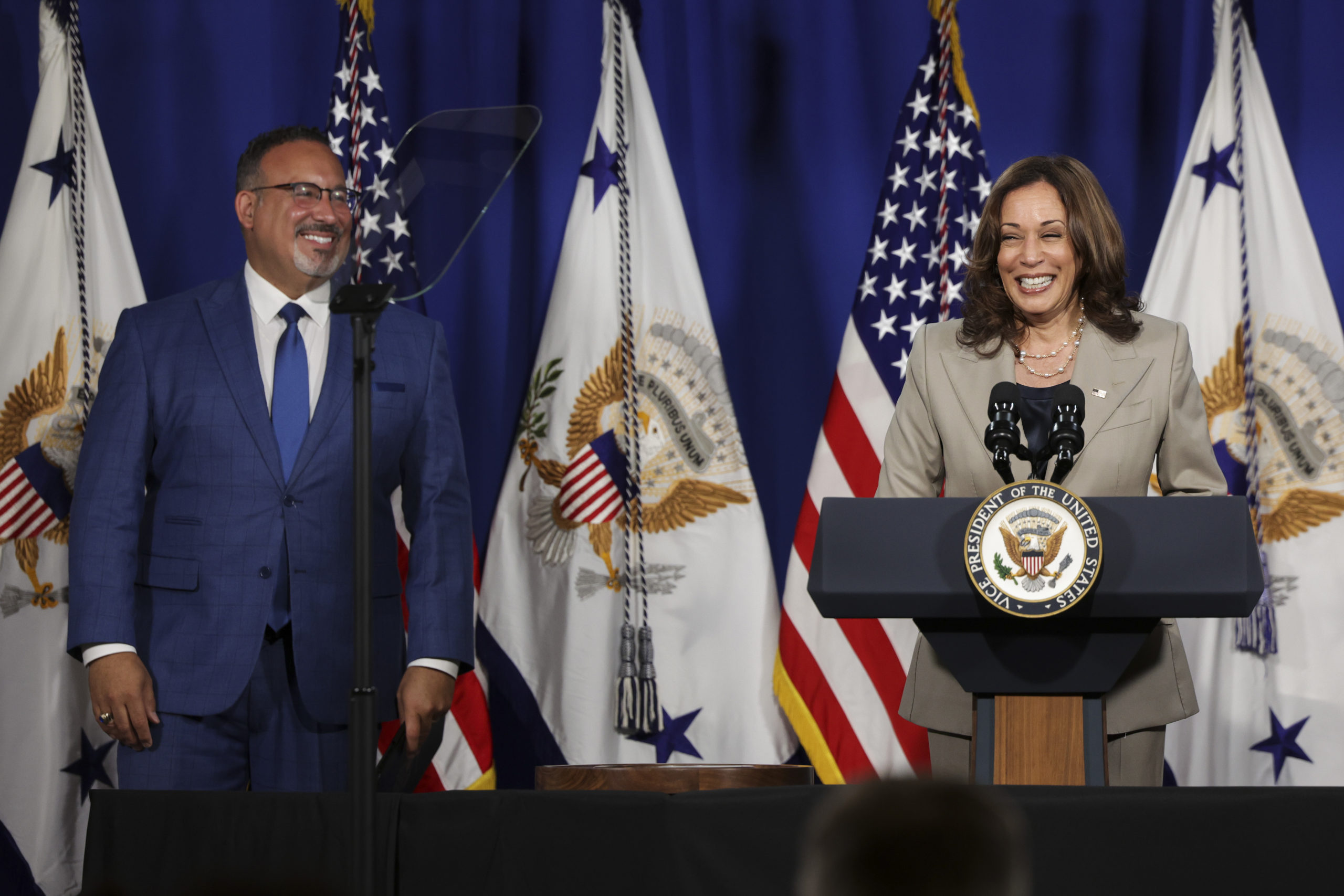 U.S. Vice President Kamala Harris speaks alongside Education Secretary Miguel Cardona as she delivers remarks on Corinthian Colleges student loan forgiveness, at the Department of Education on June 02, 2022 in Washington, DC. Harris announced the Biden Administration will cancel student debt for over half a million students from Corinthian Colleges, formerly one of the largest for-profit colleges, totalling nearly $5.8 billion in loans. (Photo by Kevin Dietsch/Getty Images)