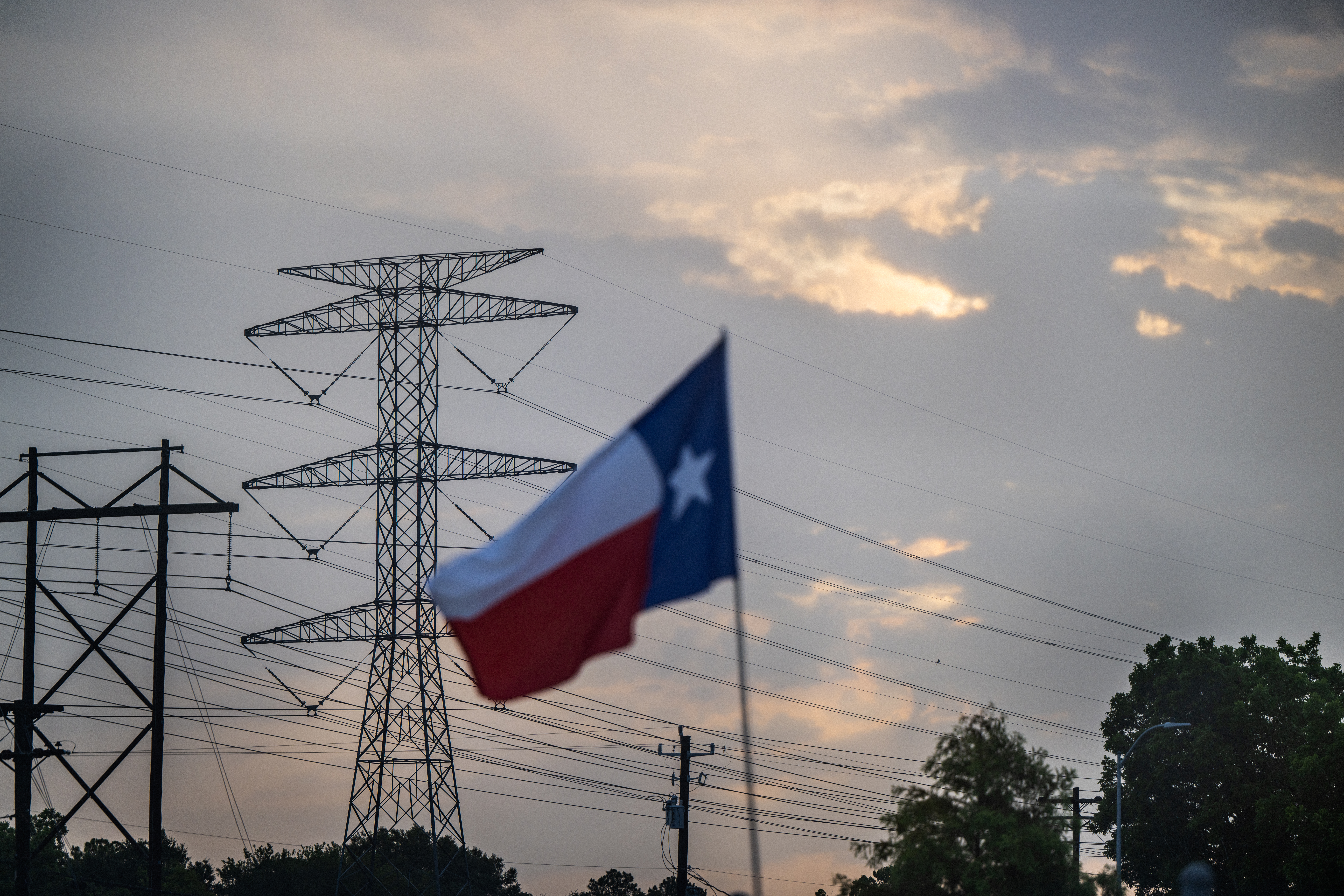 HOUSTON, TEXAS - JULY 11: A transmission tower is seen on July 11, 2022 in Houston, Texas. ERCOT (Electric Reliability Council of Texas) is urging Texans to voluntarily conserve power today, due to extreme heat potentially causing rolling blackouts. ERCOT has also projected there to be no blackouts this week. (Photo by Brandon Bell/Getty Images)