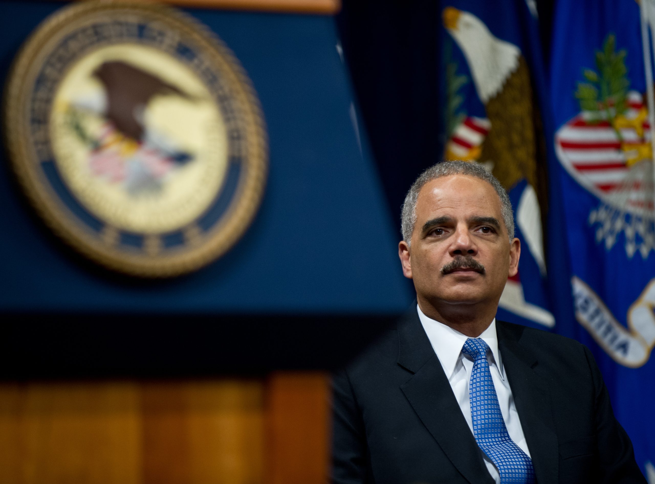 US Attorney General Eric Holder waits to address the Justice Department's Lesbian, Gay, Bisexual and Transgender (LGBT) Pride Month event at the Justice Department in Washington,DC on June 18, 2013. AFP PHOTO/Nicholas KAMM (Photo credit should read NICHOLAS KAMM/AFP via Getty Images)