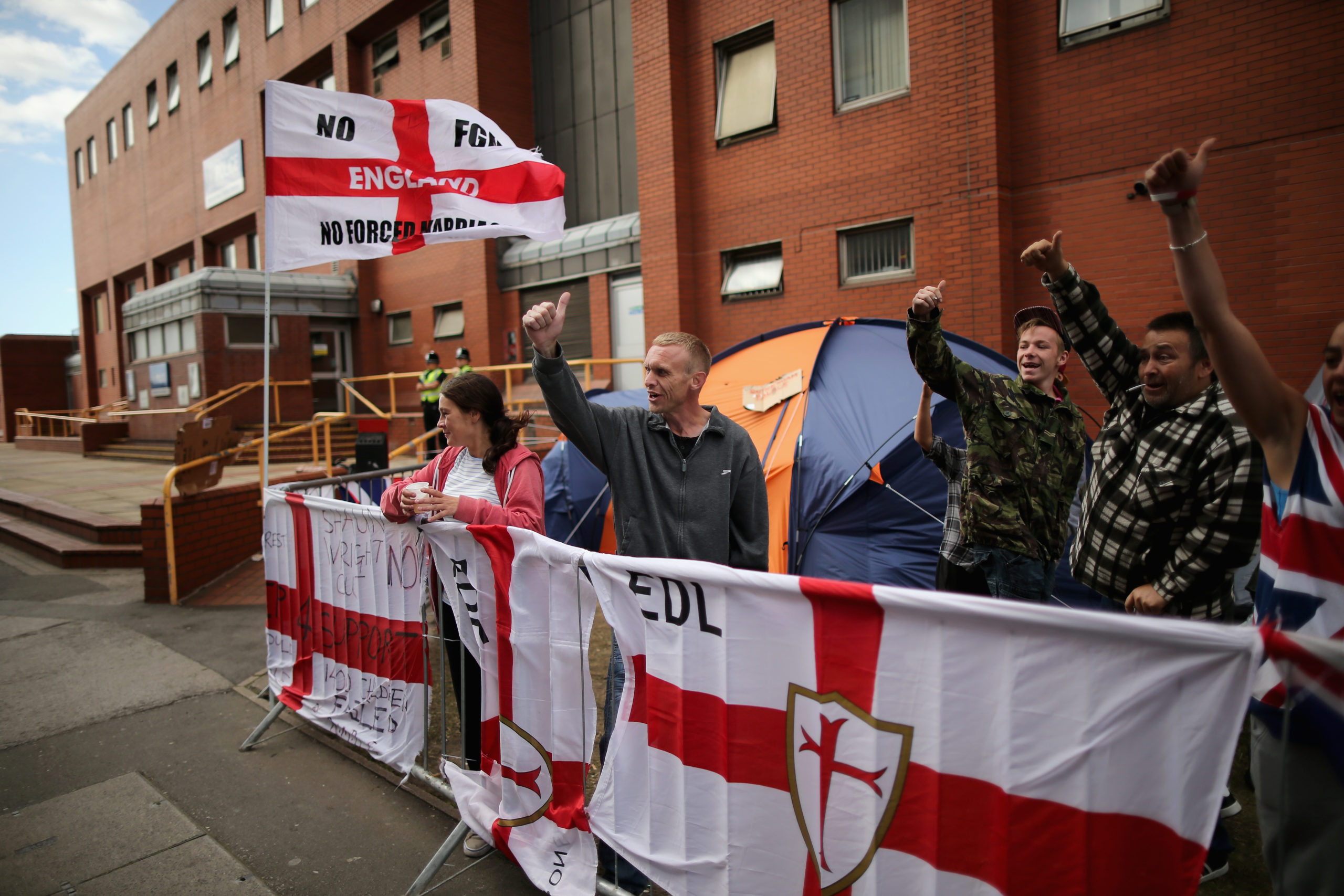 ROTHERHAM, ENGLAND - SEPTEMBER 01: Members of the EDL (English Defence League) hold a demonstration calling for the resignation of South Yorkshire Police and Crime Commissioner Shaun Wright outside the police station on September 1, 2014 in Rotherham, England. South Yorkshire Police are launching an independent investigation into its handling of the Rotherham child abuse scandal and will also probe the role of public bodies and council workers. A report claims at least 1,400 children as young as 11 were sexually abused from 1997- 2013 in Rotherham Care Homes but no council staff will face disciplinary action. (Photo by Christopher Furlong/Getty Images)