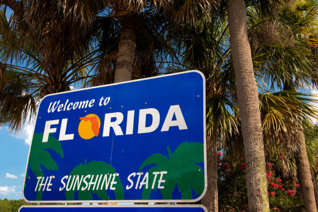 A 'Welcome to Florida' sign [Shutterstock Ingo70]