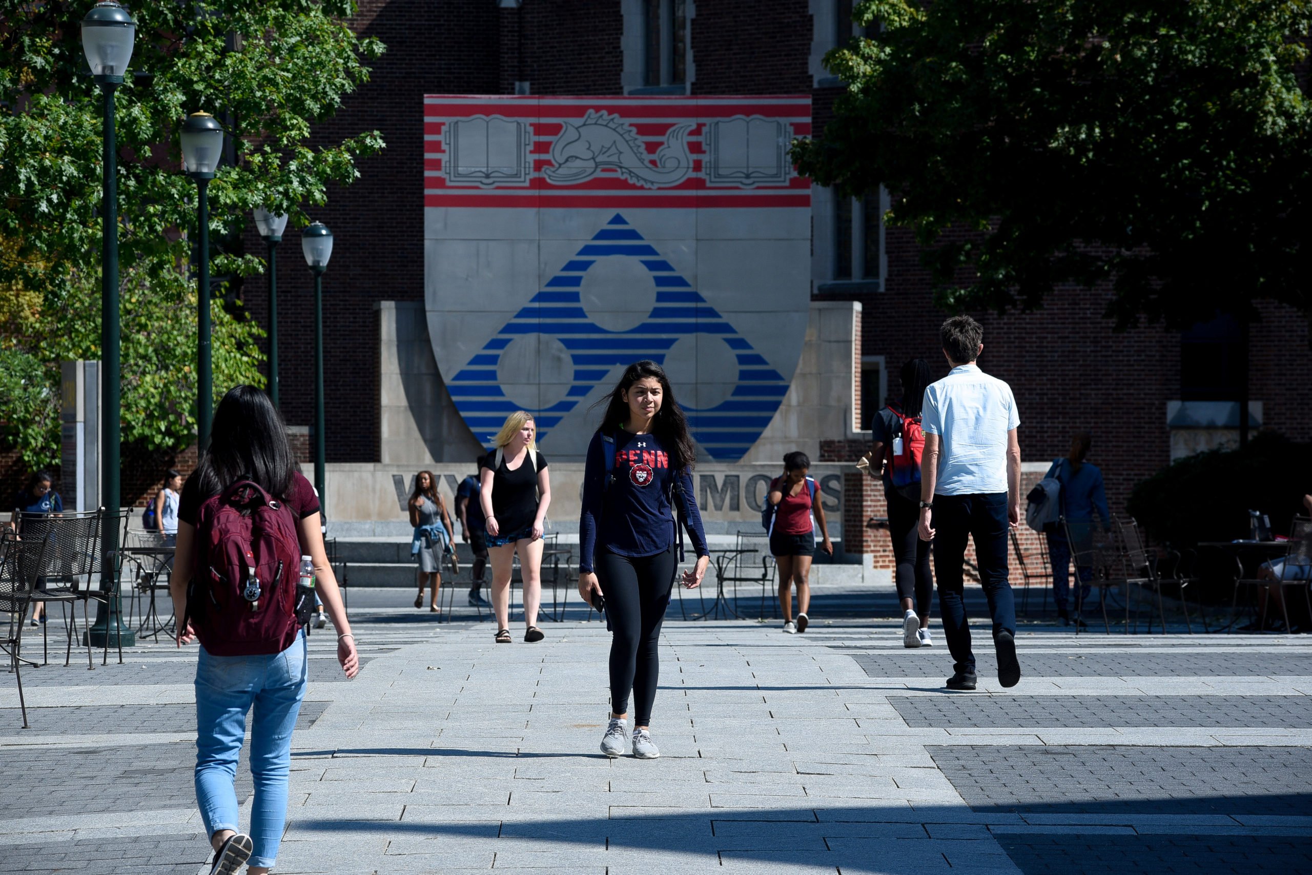 Students walk between classes in the Wynn Commons on the campus of the University of Pennsylvania in Philadelphia, Pennsylvania, U.S., September 25, 2017. REUTERS/Charles Mostoller
