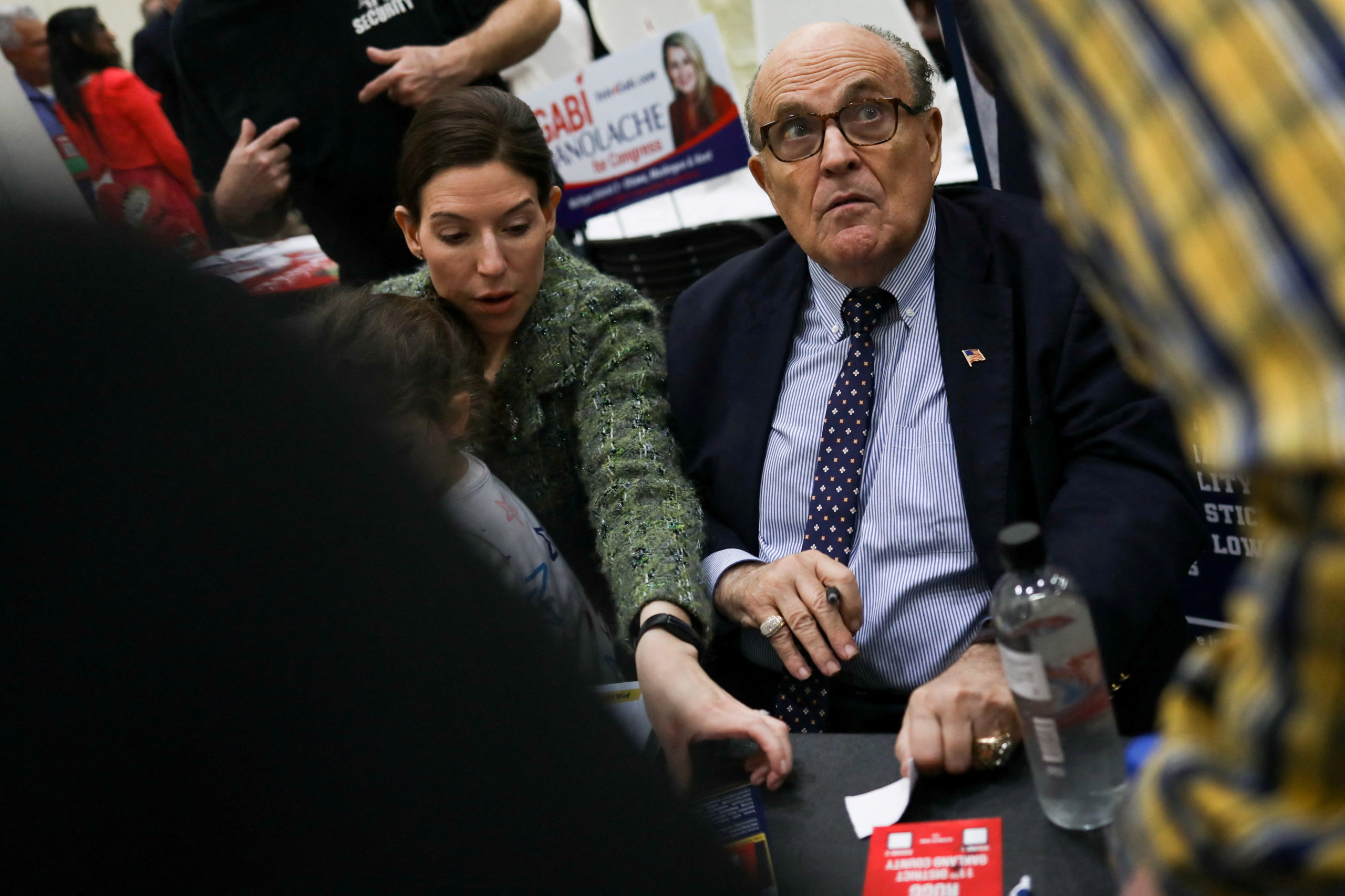 Former New York City mayor and lawyer for former President Donald Trump Rudy Giuliani greets fans as people gather for the "Empowering Michigan 2022" Michigan GOP members convention at DeVos Place in Grand Rapids, Michigan, U.S., April 23, 2022. REUTERS/Emily Elconin