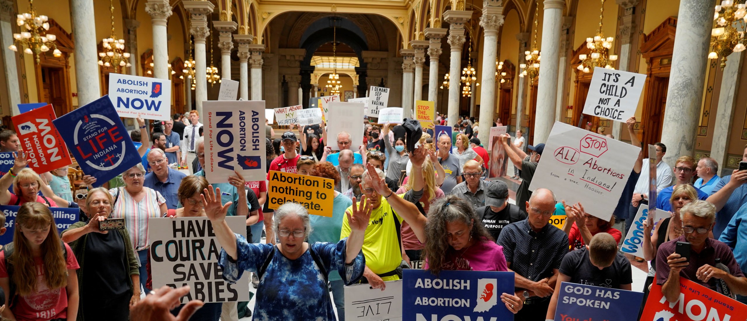Anti-abortion activists pray in the Indiana Statehouse during a special session debating on banning abortion in Indianapolis, Indiana, U.S. July 25, 2022.