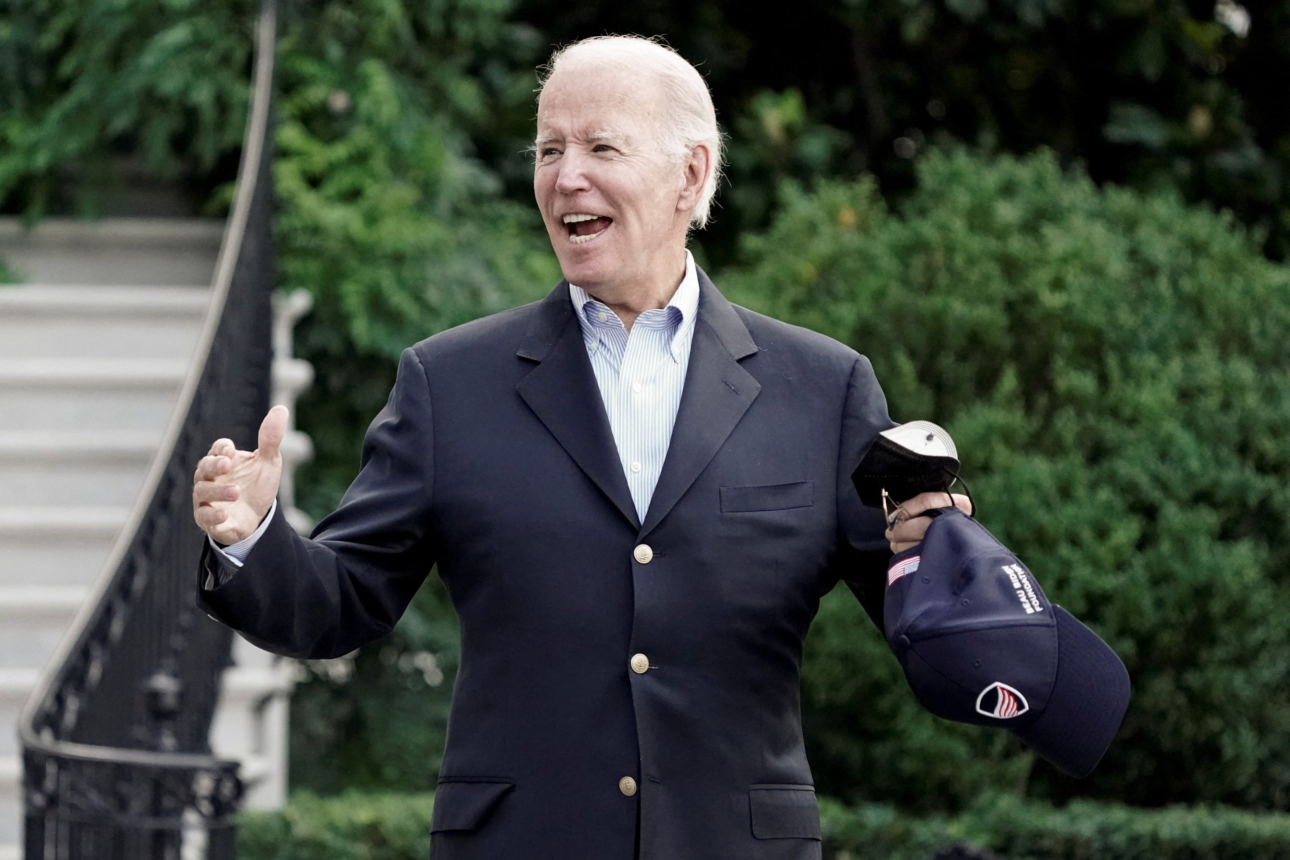 U.S. President Joe Biden gestures to the media as he walks towards Marine One for departure to Rehoboth Beach, Delaware from the South Lawn of the White House in Washington, D.C., U.S. August 7, 2022. REUTERS/Ken Cedeno