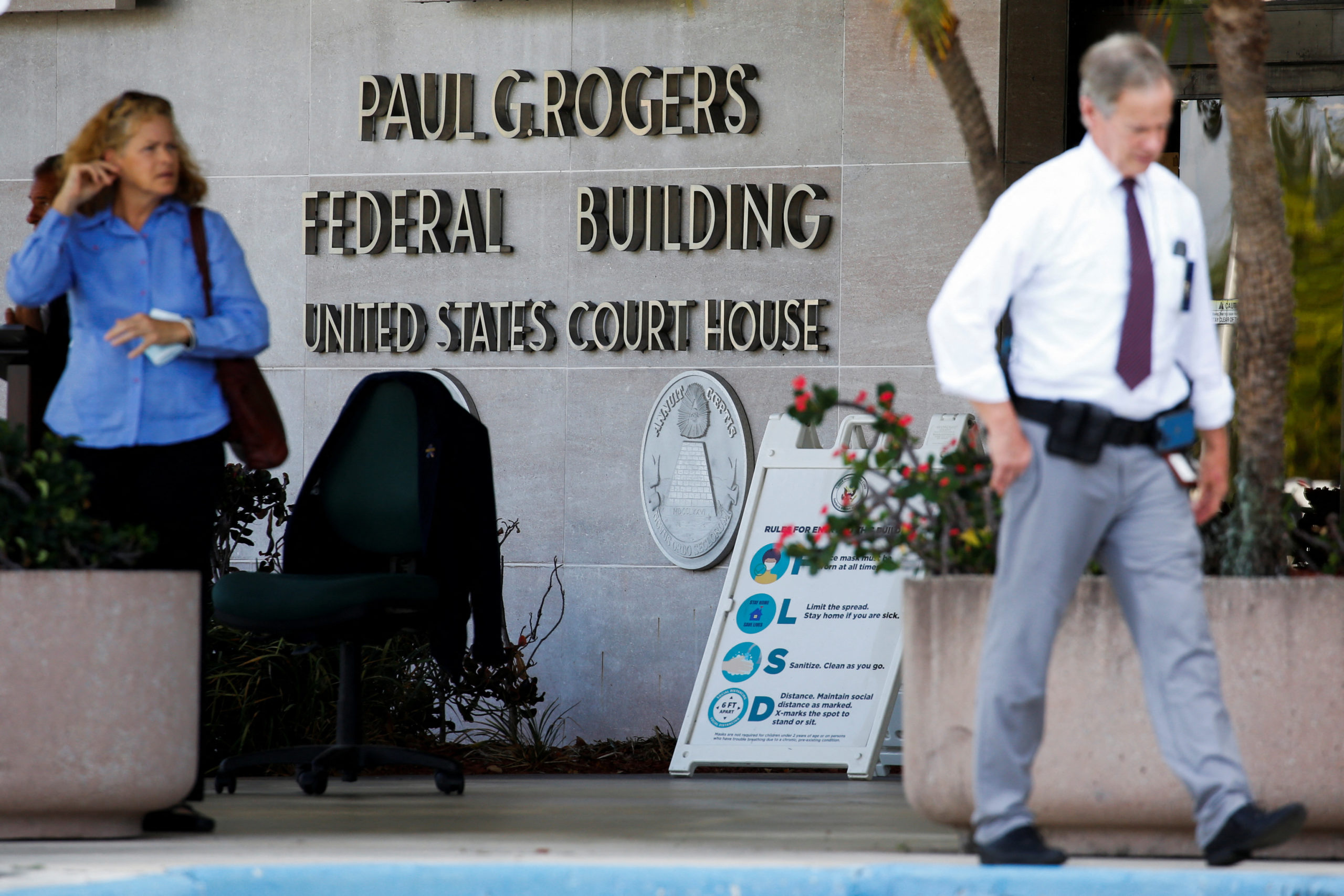 A view shows a sign in front of the Paul G. Rogers Federal Building and U.S. Courthouse, before a Federal judge holds a hearing on the motion to unseal the search warrant on former President Donald Trump's home, in West Palm Beach, Florida, U.S. August 18, 2022. REUTERS/Marco Bello
