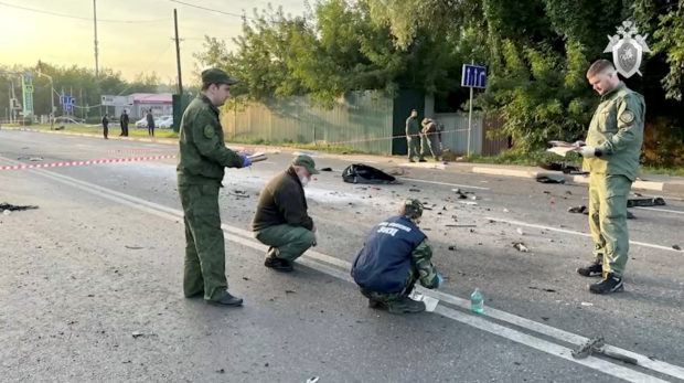 Investigators work at the site of a suspected car bomb attack that killed Darya Dugina, daughter of ultra-nationalist Russian ideologue Alexander Dugin, in the Moscow region, Russia August 21, 2022, in this still image taken from video. Investigative Committee of Russia/Handout via REUTERS ATTENTION EDITORS - THIS IMAGE HAS BEEN SUPPLIED BY A THIRD PARTY. NO RESALES. NO ARCHIVES. MANDATORY CREDIT.