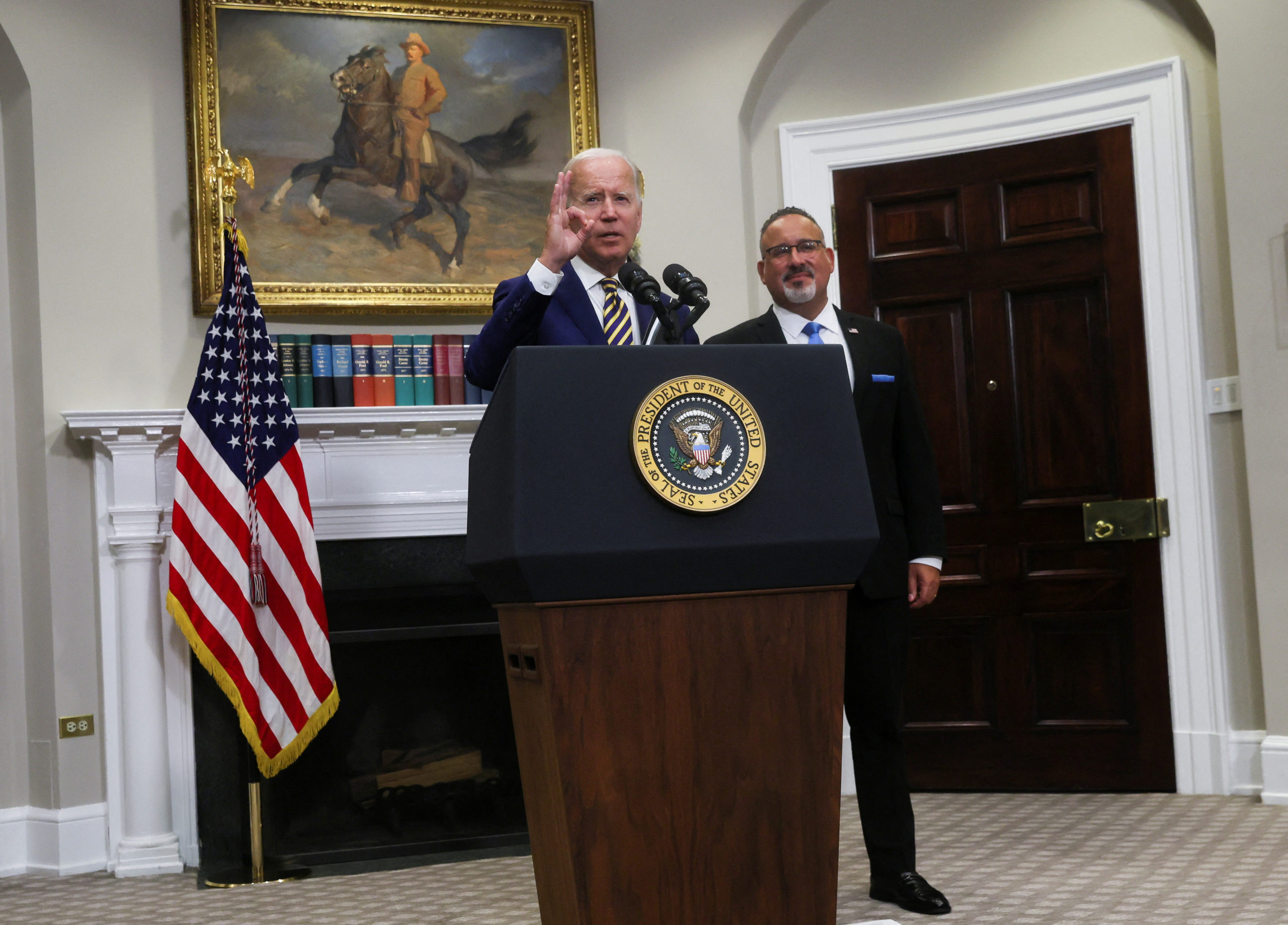U.S. President Joe Biden gestures as he responds to a question about whether he had any advance notice of the FBI's plan to search former President Donald Trump's home at Mar-a-Lago saying " I didn't have any advance notice, none, zero, not one single bit" after making remarks about forgiving federal student loan debt with U.S. Education Secretary Miguel Cardona at his side in the Roosevelt Room at the White House in Washington, U.S., August 24, 2022. REUTERS/Leah Millis