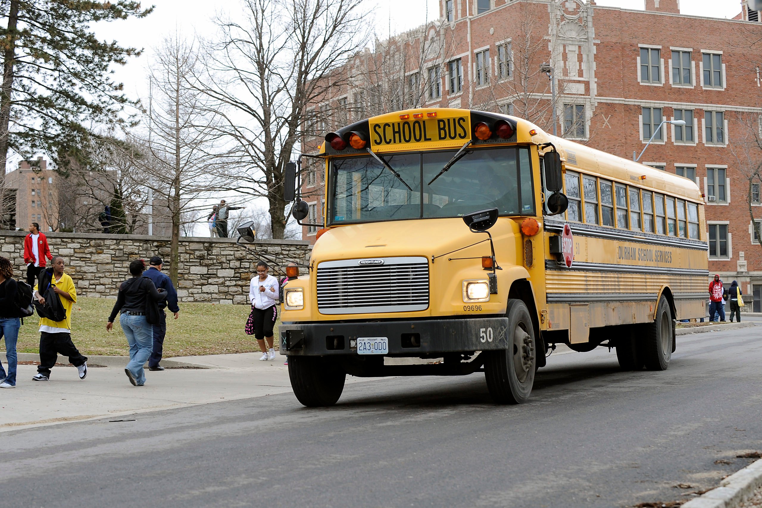 Students prepare to leave on a school bus from Westport High School on March 11, 2010 in Kansas City, Missouri. The High School is among 29 in a district of 61 schools that will close due to the new budget plan that is making the cuts to ward off bankruptcy. (Photo by G. Newman Lowrance/Getty Images)