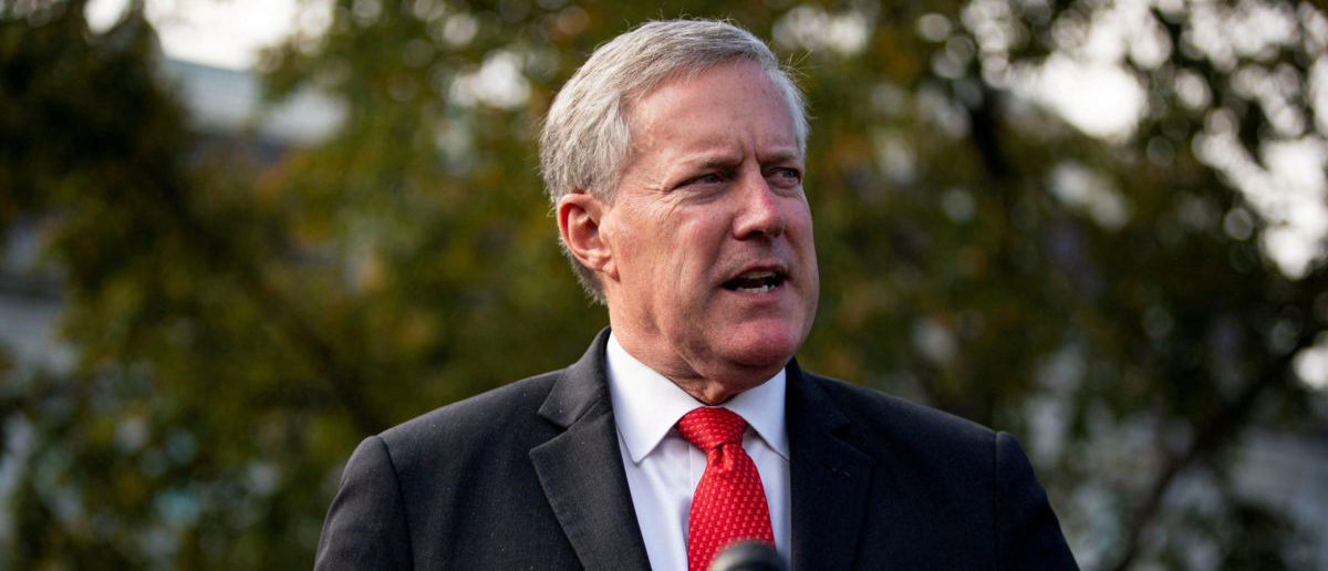 FILE PHOTO: Then-White House Chief of Staff Mark Meadows speaks to reporters following a television interview, outside the White House in Washington, U.S. October 21, 2020. REUTERS/Al Drago/File Photo
