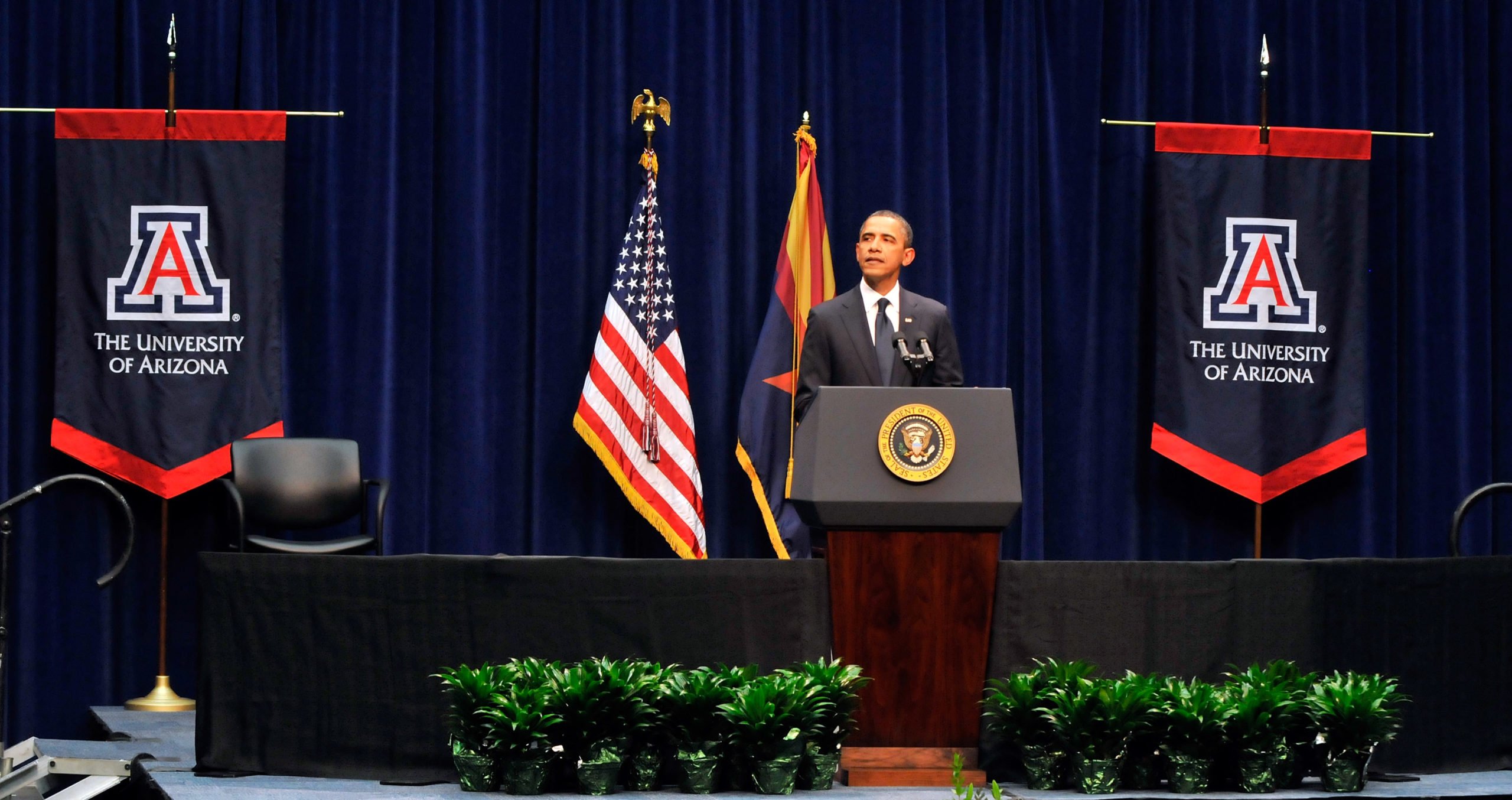 President Barack Obama gives his speech at the event 'Together We Thrive: Tucson and America' honoring the January 8 shooting victims at McKale Memorial Center on the University of Arizona campus on January 12, 2011 in Tucson, Arizona. The memorial service is in honor of victims of the mass shooting at a Safeway grocery store that killed six and injured at least 13 others, including U.S. Rep. Gabrielle Giffords (D-AZ), who remains in critical condition after being shot in the head. Among those killed were U.S. District Judge John Roll, 63; Giffords' director of community outreach, Gabe Zimmerman, 30; and 9-year-old Christina Taylor Green. (Photo by David Becker/Getty Images)