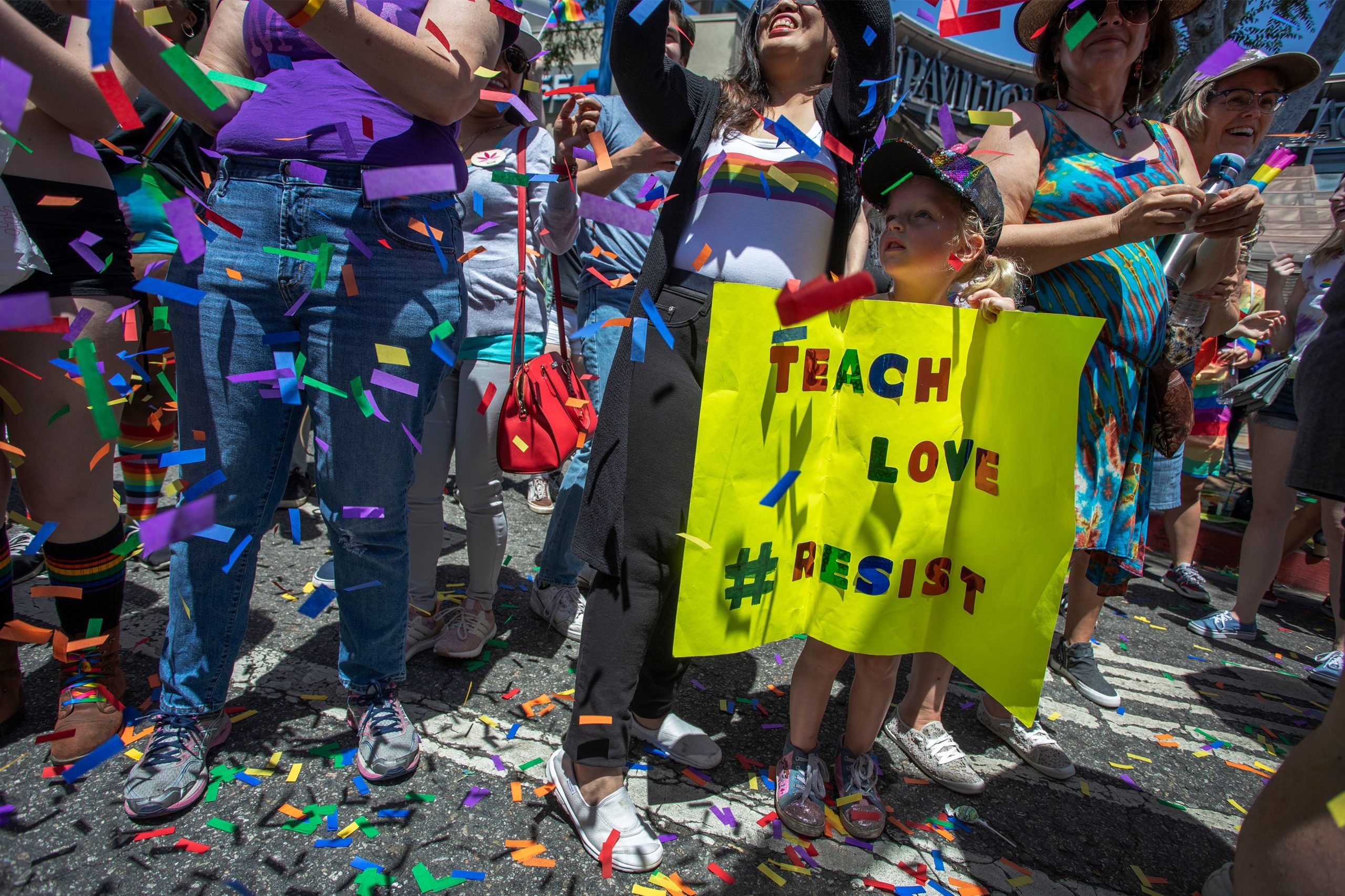 A young girl holds a sign during the annual LA Pride Parade in West Hollywood, California, on June 9, 2019. - LA Pride began on June 28, 1970, exactly one year after the historic Stonewall Rebellion in New York City, 50 years ago. (Photo by DAVID MCNEW / AFP) (Photo credit should read DAVID MCNEW/AFP via Getty Images)