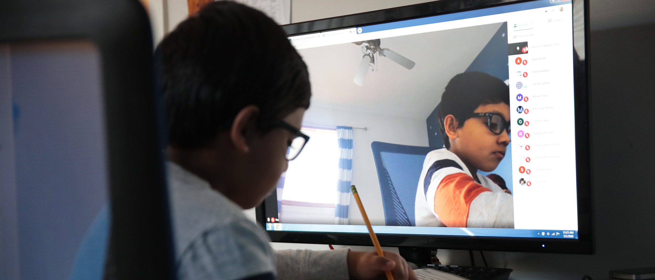 Seven-year-old Hamza Haqqani, a 2nd grade student at Al-Huda Academy, uses a computer to participate in an E-learning class with his teacher and classmates while at his home on May 01, 2020 in Bartlett, Illinois. Al-Huda Academy, an Islam based private school that teaches pre-school through the 6th grade students, has had to adopt an E-learning program to finish the school year after all schools in the state were forced to cancel classes in an attempt to curtail the spread of the COVID-19 pandemic. (Photo by Scott Olson/Getty Images)