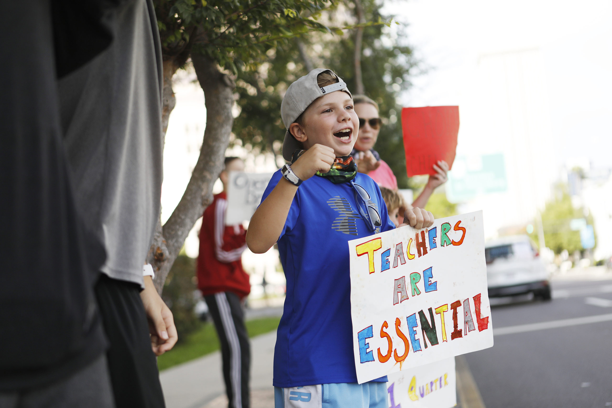 Fifth-grader Jackson Pijanowski a supporter calling for Hillsborough County schools to reopen protests ahead of a meeting of the school board at the Hillsborough County Public Schools district office on August 6, 2020 in Tampa, Florida. The Hillsborough County School Board held a special meeting to decide if schools will reopen during the COVID-19 pandemic. (Photo by Octavio Jones/Getty Images)