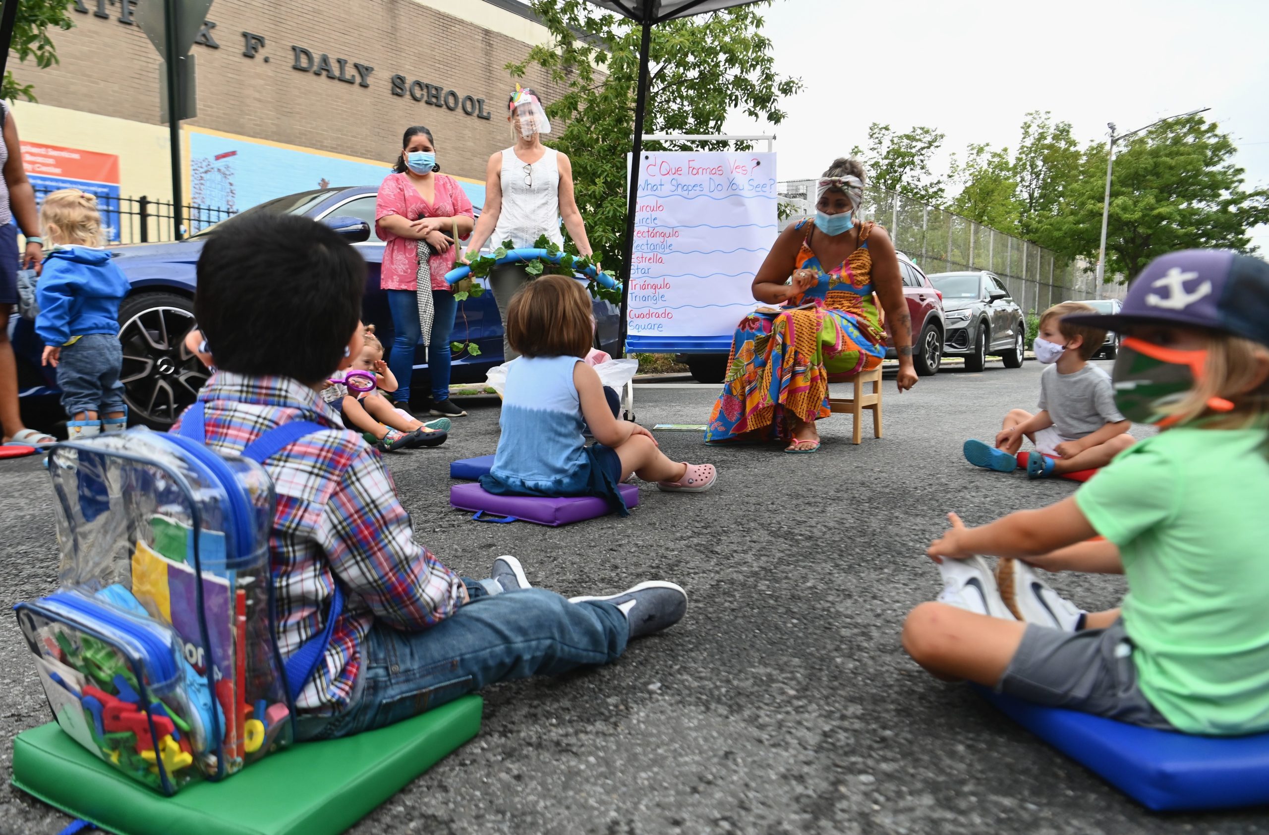 A teacher conducts a lesson with students during an outdoor learning demonstration for New York City schools in front of the Patrick F. Daly public school (P.S. 15) on September 2, 2020 in the Brooklyn borough of New York City. (Photo by Angela Weiss / AFP) (Photo by ANGELA WEISS/AFP via Getty Images)