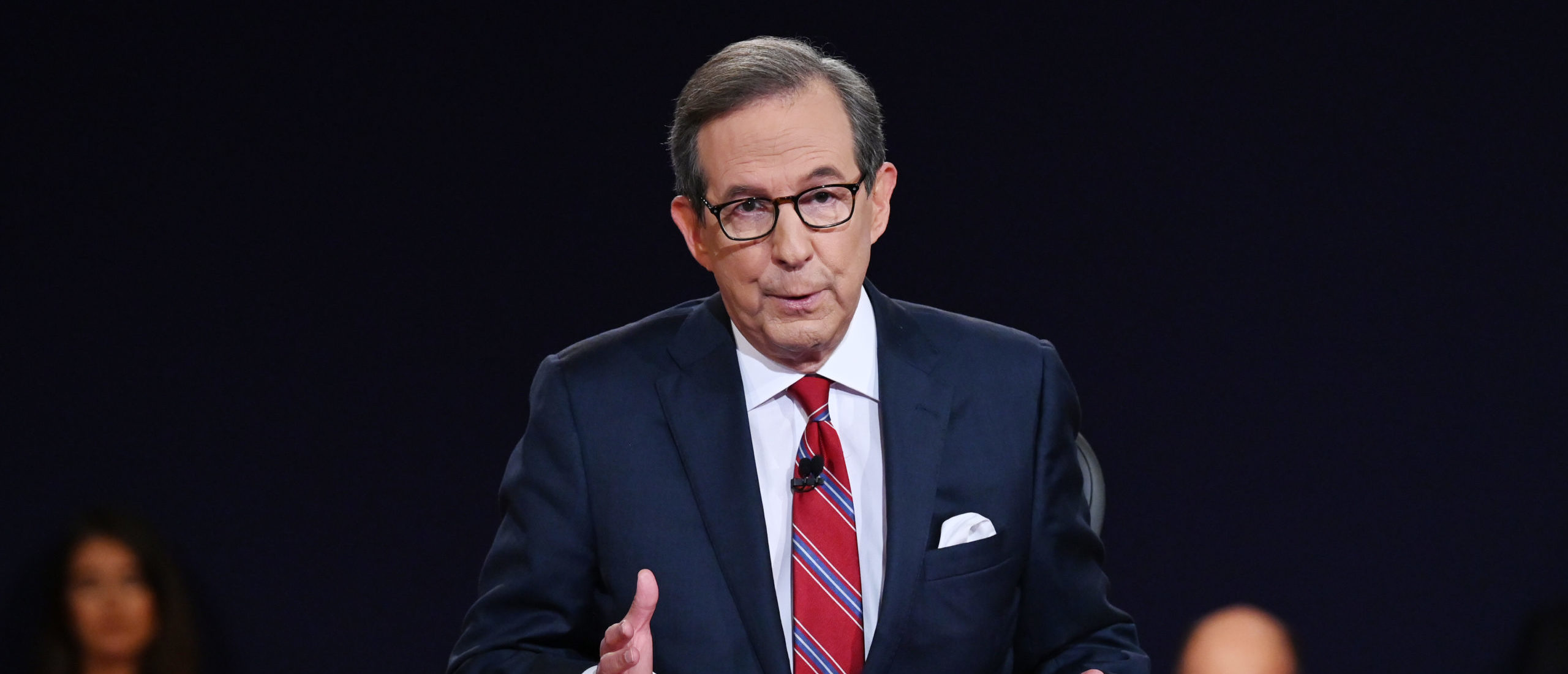 CLEVELAND, OHIO - SEPTEMBER 29: Debate moderator and Fox News anchor Chris Wallace directs the first presidential debate between U.S. President Donald Trump and Democratic presidential nominee Joe Biden at the Health Education Campus of Case Western Reserve University on September 29, 2020 in Cleveland, Ohio. This is the first of three planned debates between the two candidates in the lead up to the election on November 3. (Photo by Olivier Douliery-Pool/Getty Images)