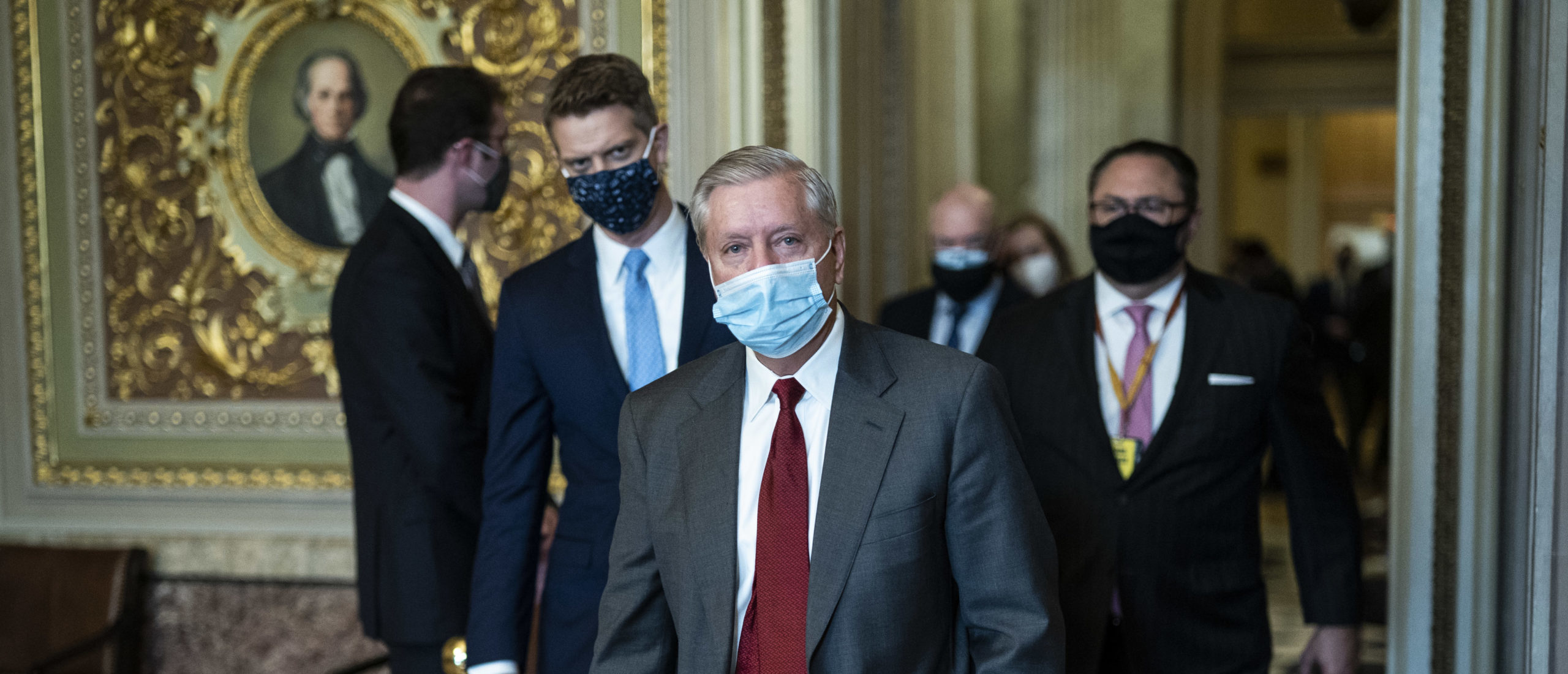WASHINGTON, DC - FEBRUARY 12: Sen. Lindsey Graham (R-SC) walks with Jason Miller to a meeting room for former President Donald Trump's defense lawyers on the fourth day of the Senate Impeachment trials for Trump on Capitol Hill on February 12, 2021 in Washington, DC. (Photo by Jabin Botsford - Pool/Getty Images)