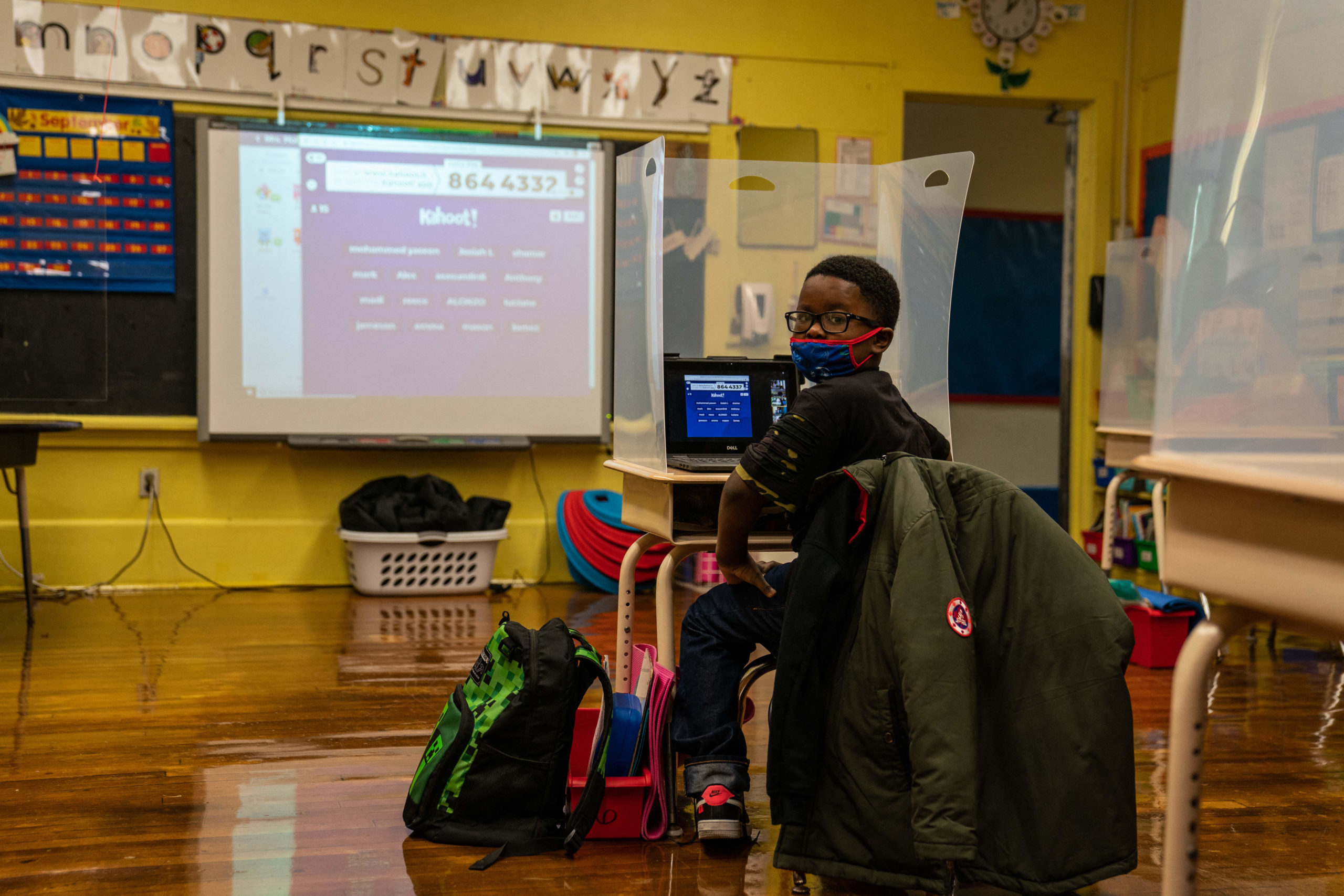 A students waits for First Lady Jill Biden to arrive to his classroom at the Samuel Smith Elementary School in Burlington, New Jersey on March 15, 2021. (Photo by Anna Moneymaker / POOL / AFP) (Photo by ANNA MONEYMAKER/POOL/AFP via Getty Images)