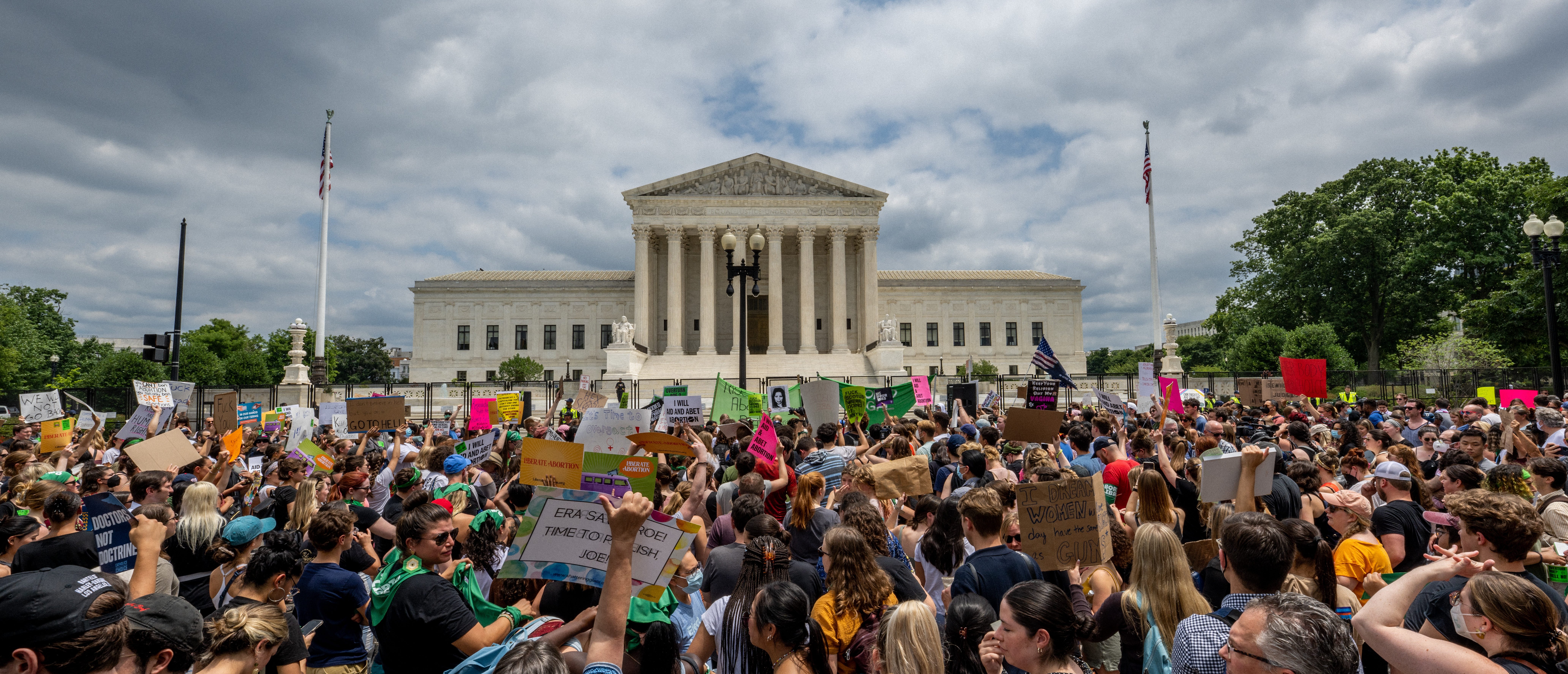WASHINGTON, DC - JUNE 24: People protest in response to the Dobbs v Jackson Women's Health Organization ruling in front of the U.S. Supreme Court on June 24, 2022 in Washington, DC. (Photo by Brandon Bell/Getty Images)