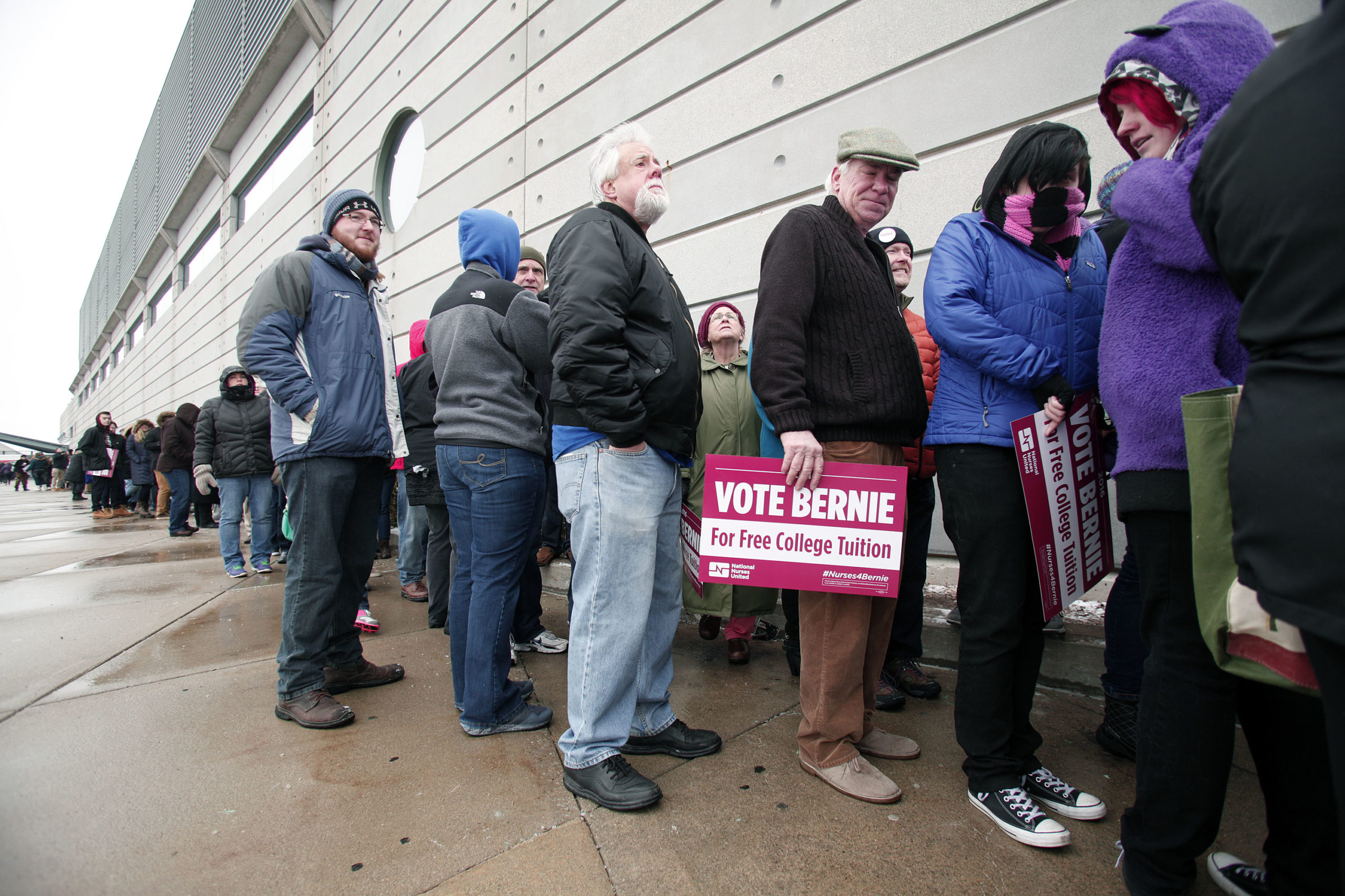 People wait in line in the cold to get into U.S. Senator and Democratic Presidential Candidate Bernie Sanders first campaign rally in Michigan at Eastern Michigan University February 15, 2016 in Ypsilanti, Michigan. Sanders is expected to speak on a wide range of issues, including his plans to make public colleges and universities tuition-free. The next voting for the democratic candidates will be the Democratic caucus in Nevada on February 20. (Photo by Bill Pugliano/Getty Images)