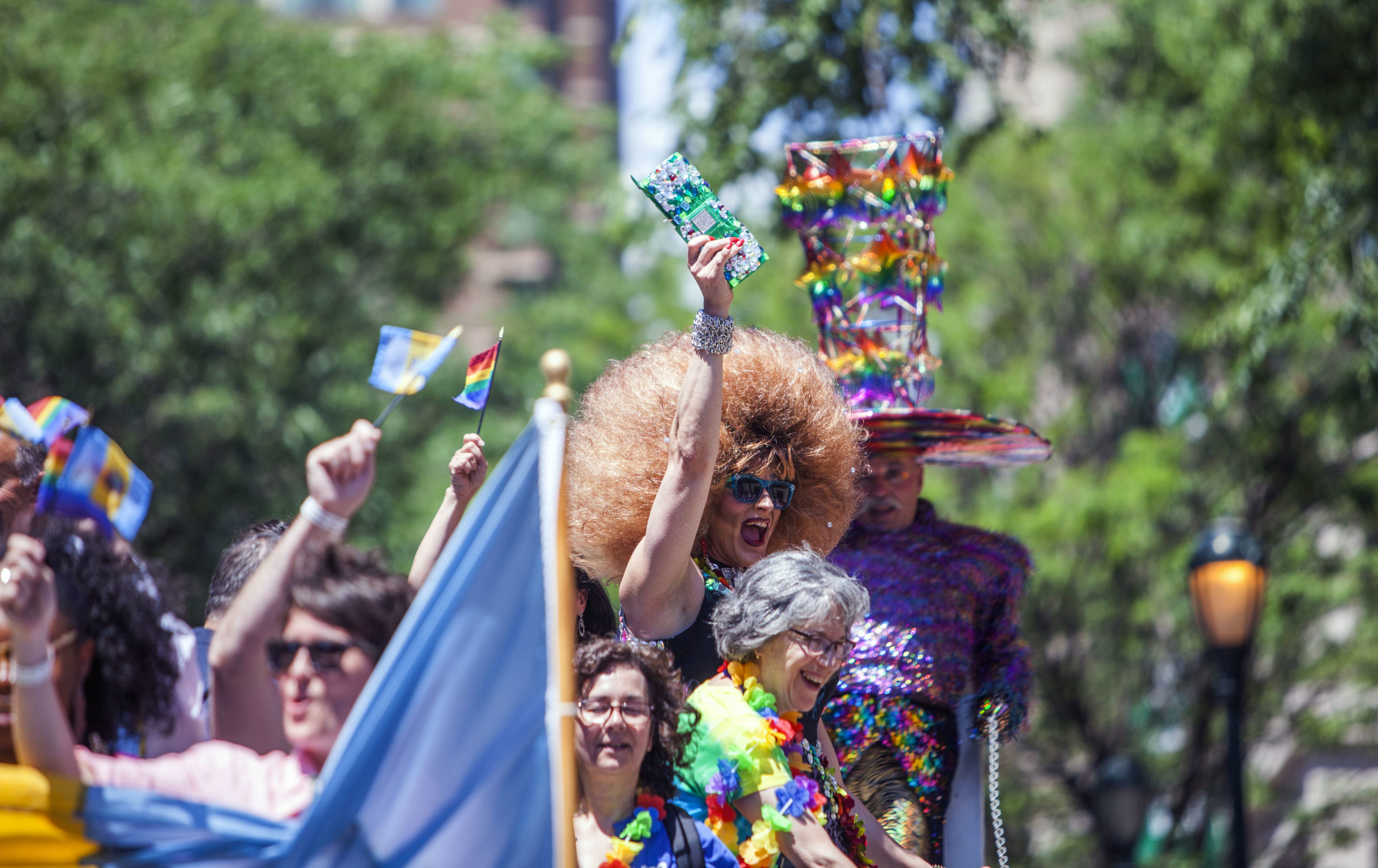Grand Marshals wave from a float as they participate in the 2016 Gay Pride Parade march through downtown on June 12, 2016 in Philadelphia, Pennsylvania. The mood was celebratory despite news of the mass shooting this morning in a gay club in Orlando, Florida. (Photo by Jessica Kourkounis/Getty Images)