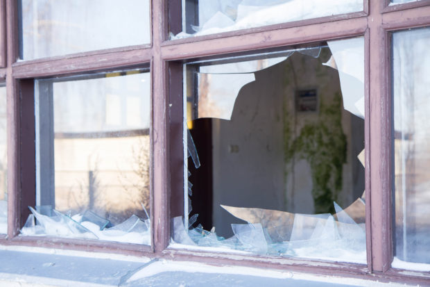A broken window in a close up shot. This image does not depict the incident mentioned in story [Aleksandra Duda Shutterstock]