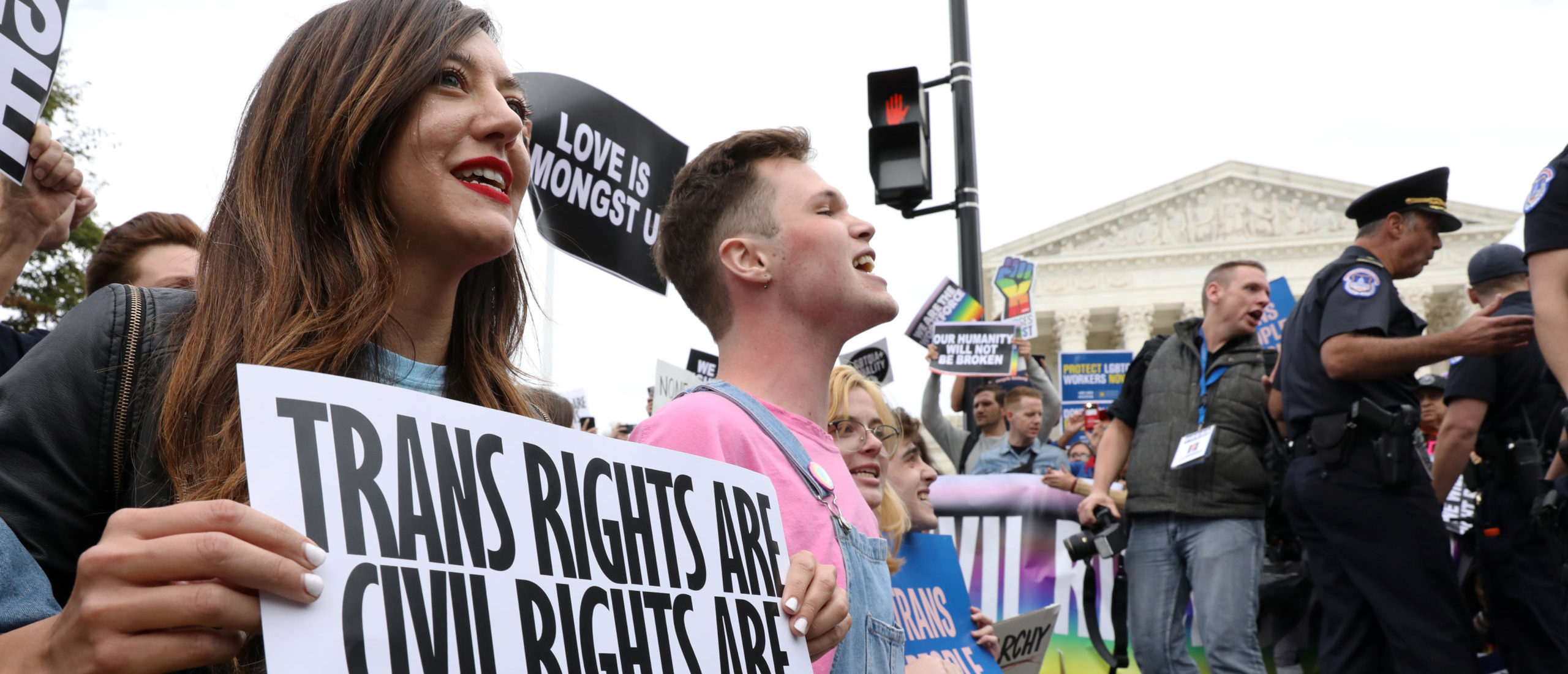LGBTQ activists and supporters block the street outside the U.S. Supreme Court as it hears arguments in a major LGBT rights case on whether a federal anti-discrimination law that prohibits workplace discrimination on the basis of sex covers gay and transgender employees in Washington, U.S. October 8, 2019. REUTERS/Jonathan Ernst