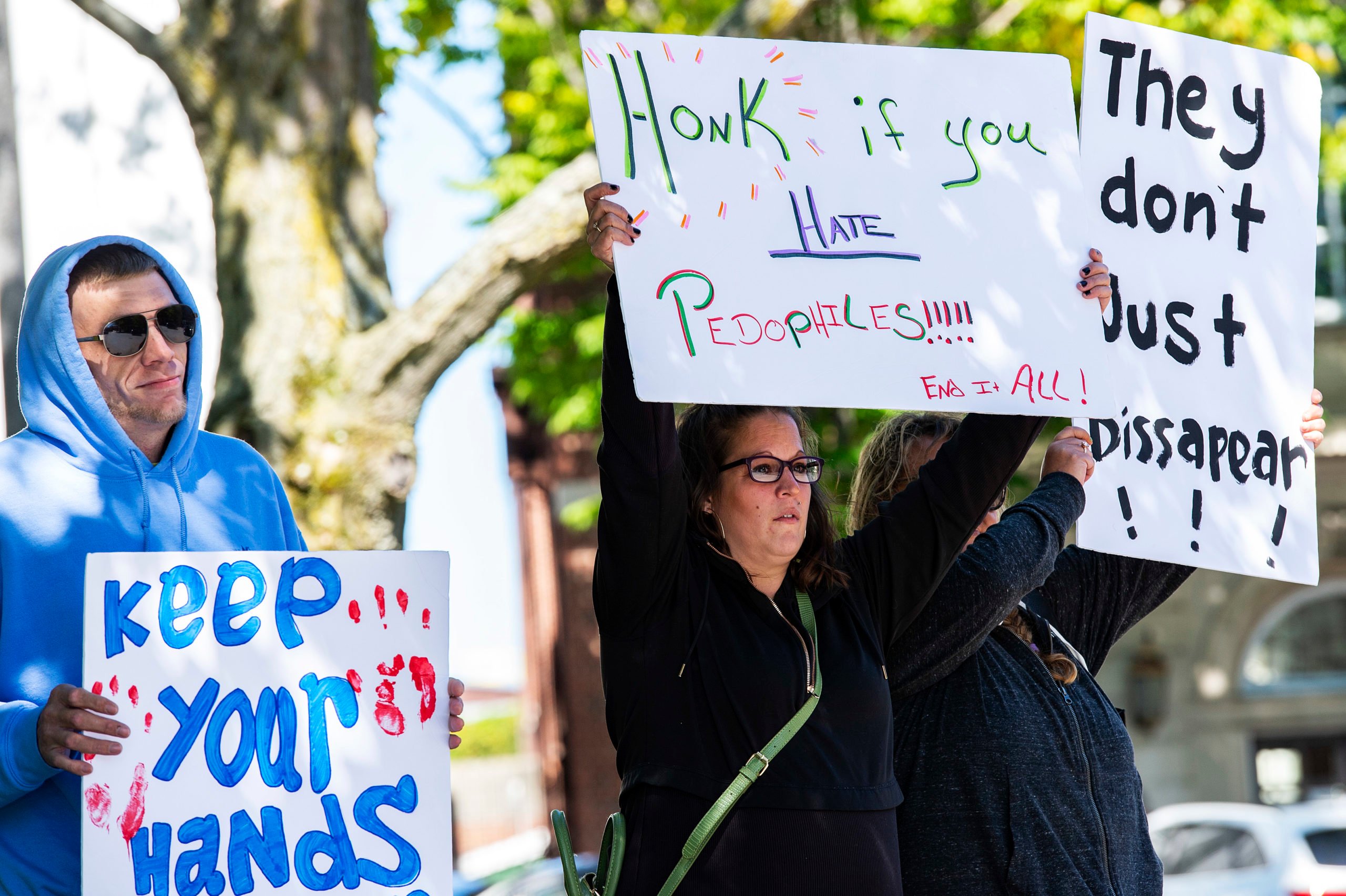Demonstrators in Keene, New Hampshire, gather at a "Save the Children Rally" to protest child sex trafficking and pedophilia around the world, on September 19, 2020. - Anti-paedophilia protests are flaring in th US where the QAnon movement started. QAnon is the umbrella term for a sprawling set of internet conspiracy theories that allege that the world is run by a cabal of Satan-worshiping pedophiles who are plotting against US President Donald Trump while operating a global child sex-trafficking ring. (Photo by Joseph Prezioso / AFP) (Photo by JOSEPH PREZIOSO/AFP via Getty Images)