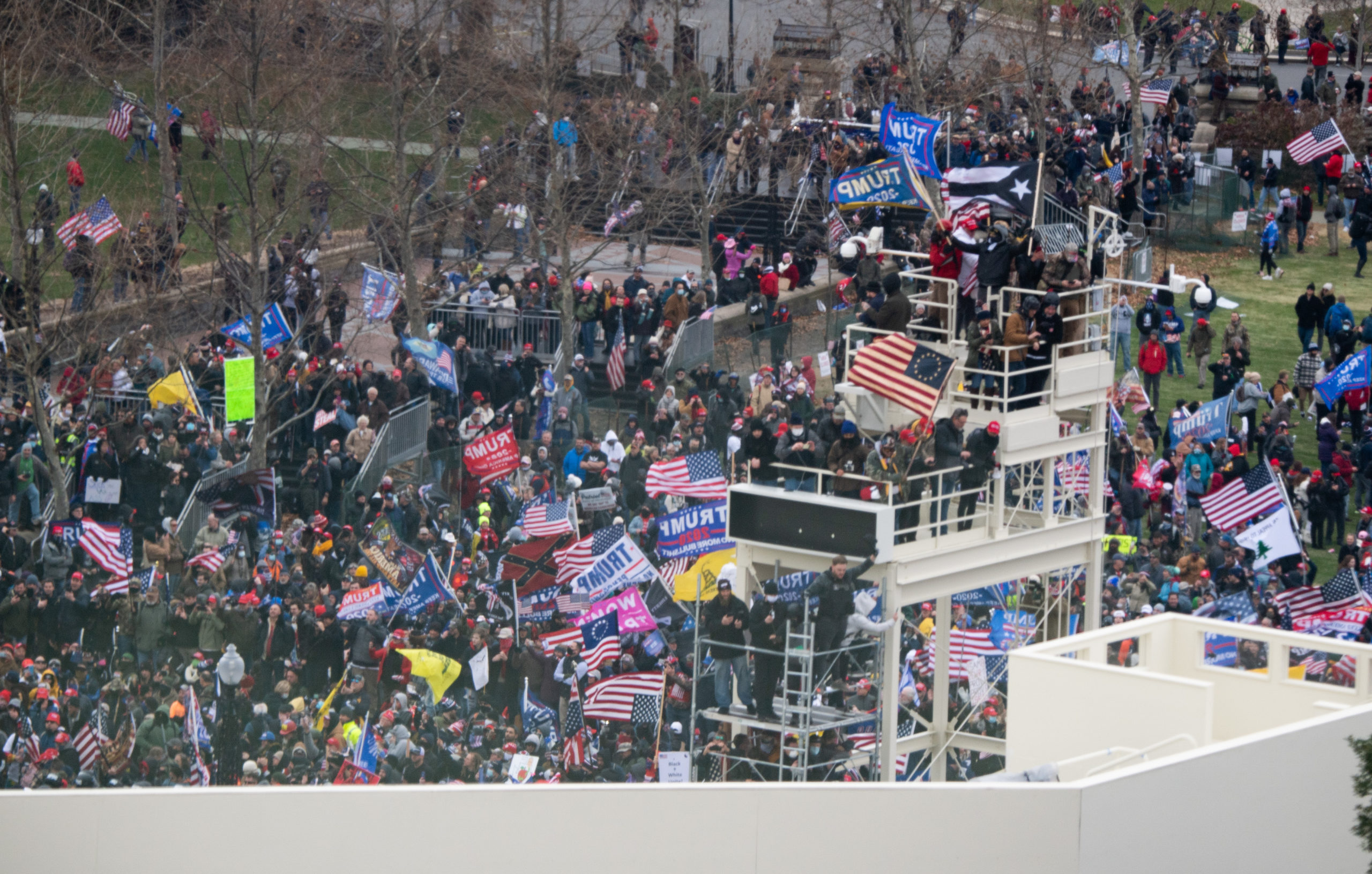 Supporters of US President Donald Trump take over stands set up for the presidential inauguration as they protest at the US Capitol in Washington, DC, January 6, 2021. - Thousands of Trump supporters, fueled by his spurious claims of voter fraud, are flooding the nation's capital protesting the expected certification of Joe Biden's White House victory by the US Congress. SAUL LOEB/AFP via Getty Images