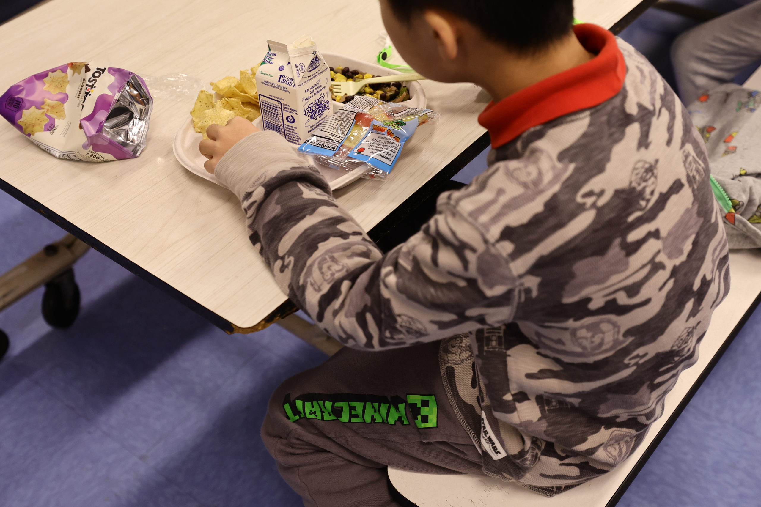 A student eats a vegan meal served for lunch (with milk as a drink) at Yung Wing School P.S. 124 on February 04, 2022 in New York City. Starting today, the Department of Education in New York City, which introduced Meatless Mondays in 2019 and Meatless Fridays this past April, will start phasing in “vegan-focused” menus on Fridays or “Vegan Fridays” as part of Mayor Eric Adams’ initiative to serve healthier food to students. (Photo by Michael Loccisano/Getty Images)