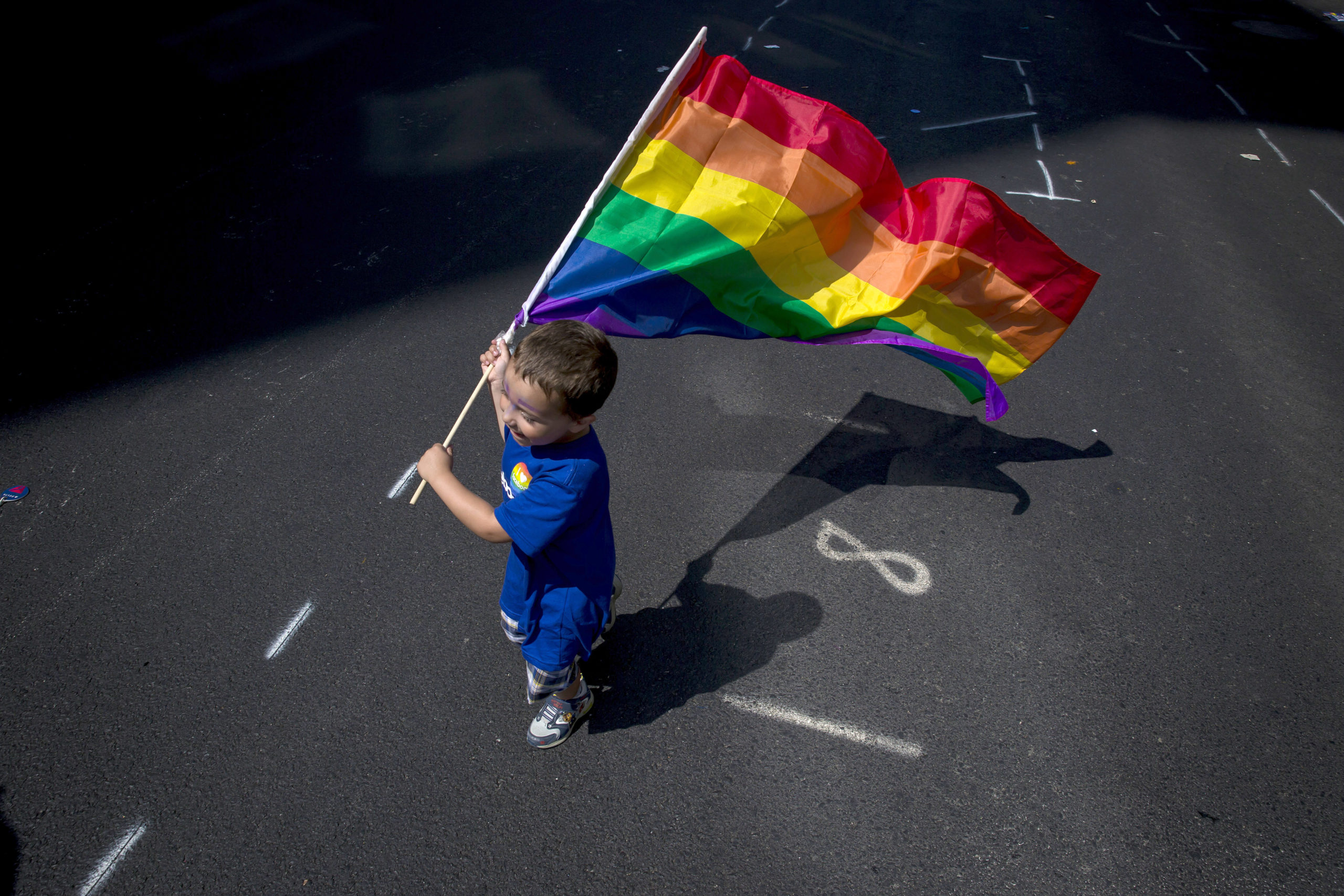 A boy carries a flag during the New York City Pride March, June 26, 2016 in New York City. This year was the 46th Pride march in New York City (Photo by Eric Thayer/Getty Images)