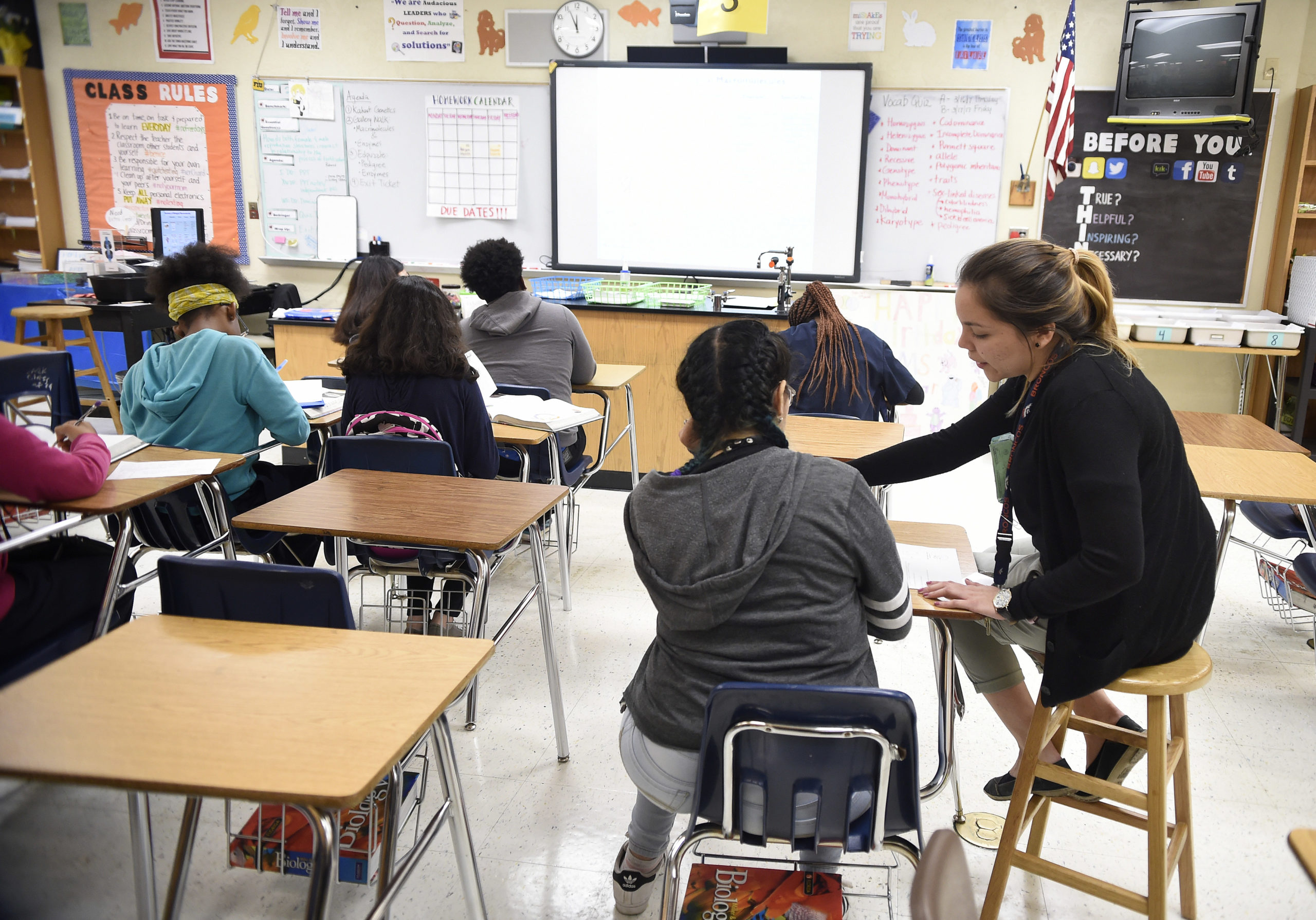 Science teacher Virginia Escobar-Cheng works with her students in a science class in a high school in Homestead, Florida, on March 10, 2017. Texas state legislators are now considering a bill introduced in February that would offer teachers like Garlington some legal protection, by giving them latitude to present science "that may cause controversy" as a debatable theory. Texas is one of eight US states where such laws have been proposed since the beginning of the year. South Dakota, Oklahoma, Iowa, Alabama, Indiana, Florida and Arkansas are the others. / AFP PHOTO / RHONA WISE / The erroneous mention[s] appearing in the metadata of this photo by RHONA WISE has been modified in AFP systems in the following manner: [March 10, 2017 instead of [March 10, 2010]. Please immediately remove the erroneous mention[s] from all your online services and delete it (them) from your servers. If you have been authorized by AFP to distribute it (them) to third parties, please ensure that the same actions are carried out by them. Failure to promptly comply with these instructions will entail liability on your part for any continued or post notification usage. Therefore we thank you very much for all your attention and prompt action. We are sorry for the inconvenience this notification may cause and remain at your disposal for any further information you may require. (Photo credit should read RHONA WISE/AFP via Getty Images)