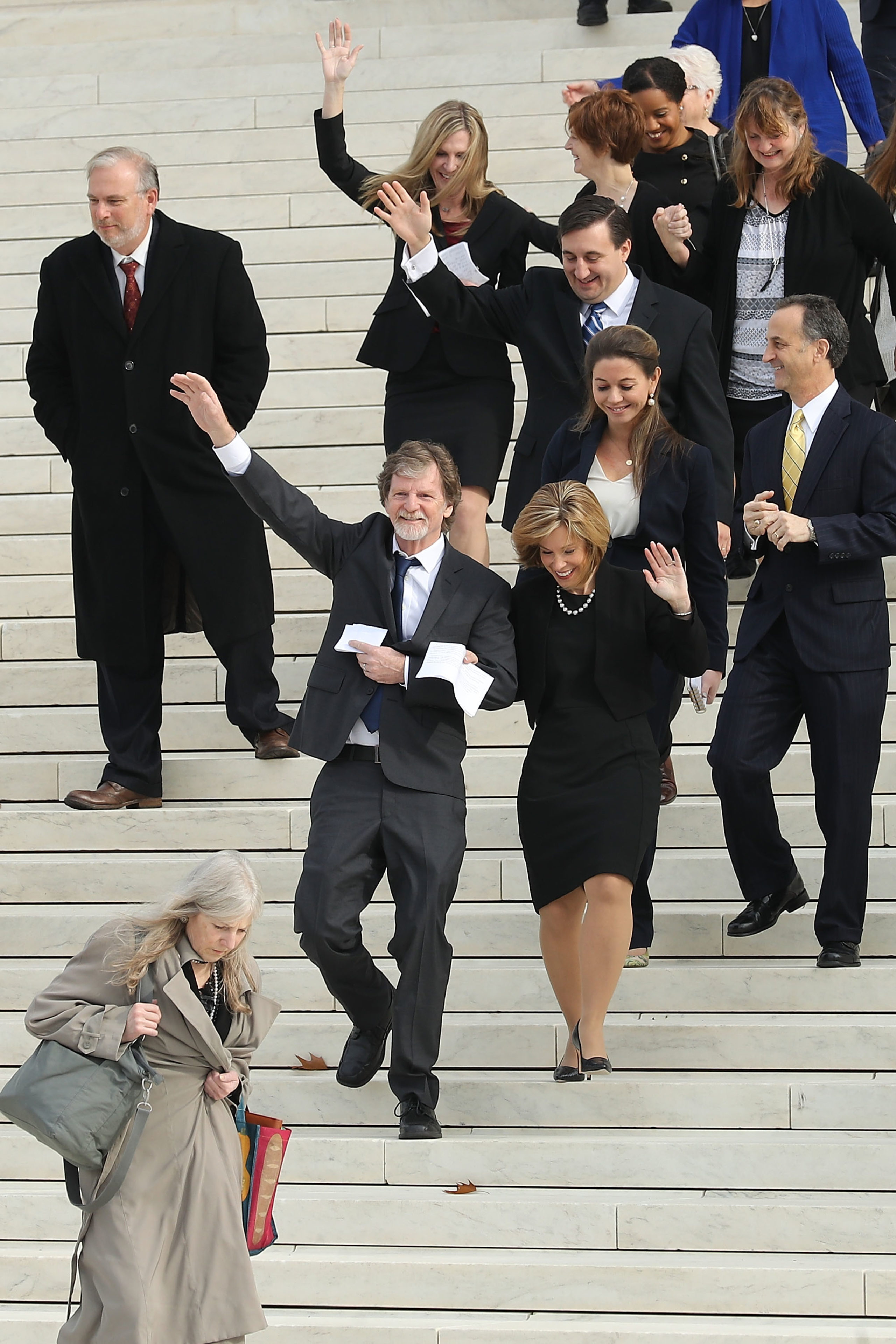 Conservative Christian baker Jack Phillips (3rd L) waves to supporters as he walks out of the U.S. Supreme Court building after the court heard the case Masterpiece Cakeshop v. Colorado Civil Rights Commission December 5, 2017 in Washington, DC. Siting his religious beliefs, Phillips refused to sell a gay couple a wedding cake for their same-sex ceremony in 2012, beginning a legal battle over freedom of speech and religion. (Photo by Chip Somodevilla/Getty Images)