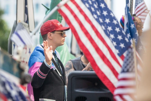 BOSTON, MA - AUGUST 31: Milo Yiannopoulos rides on a large Trump 2020 parade float during the Boston Straight Pride Parade on August 31, 2019 in Boston, Massachusetts. The organization Super Happy Fun America, which claims to advocate "on behalf of the straight community in order to foster respect and awareness with people from all walks of life," planned the event which featured a float with adorned with "Trump 2020" and "Build the Wall," signs among other phrases coined by President Trump. (Photo by Scott Eisen/Getty Images)