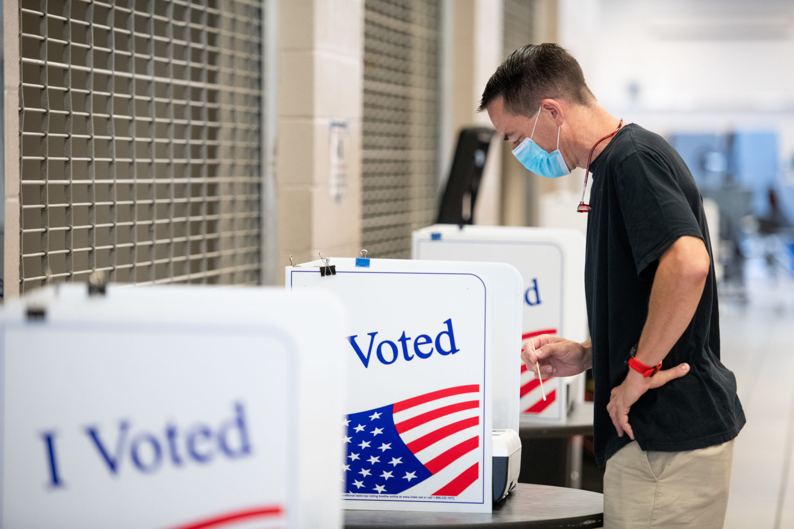 John Sherer casts a vote using a swab at Dreher High School on June 9, 2020 in Columbia, South Carolina. Georgia, Nevada, North Dakota, South Carolina and West Virginia hold primaries today. (Photo by Sean Rayford/Getty Images)