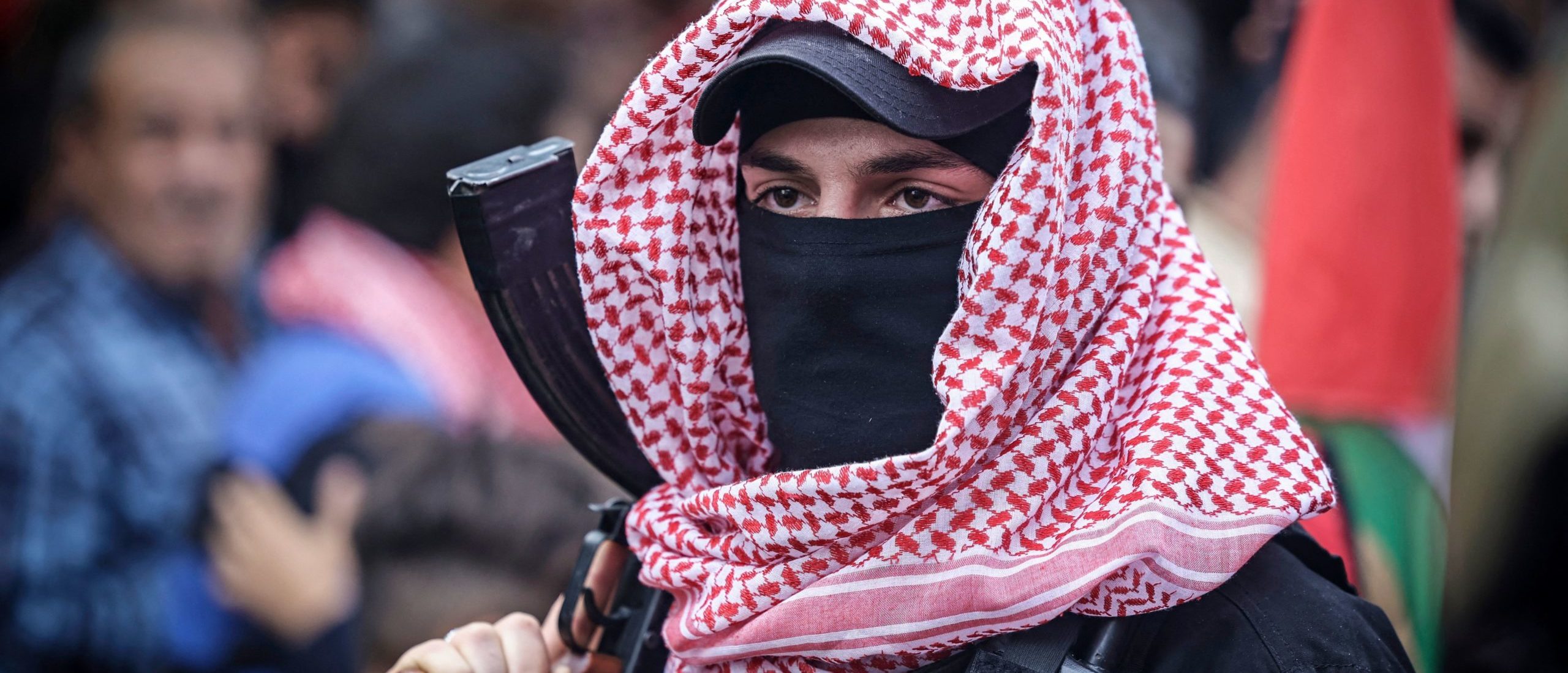 An armed member of the Popular Front for the Liberation of Palestine (PLFP) takes part in a rally marking the 56th anniversary of the movement's foundation in Gaza City on December 13, 2021.