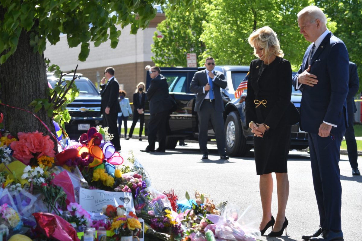 TOPSHOT - US President Joe Biden and US First Lady Jill Biden visit a memorial near a Tops grocery store in Buffalo, New York, on May 17, 2022. - Biden is visiting Buffalo after ten people were killed in a mass shooting at a grocery store on May 14, 2022. (Photo by Nicholas Kamm / AFP) (Photo by NICHOLAS KAMM/AFP via Getty Images)