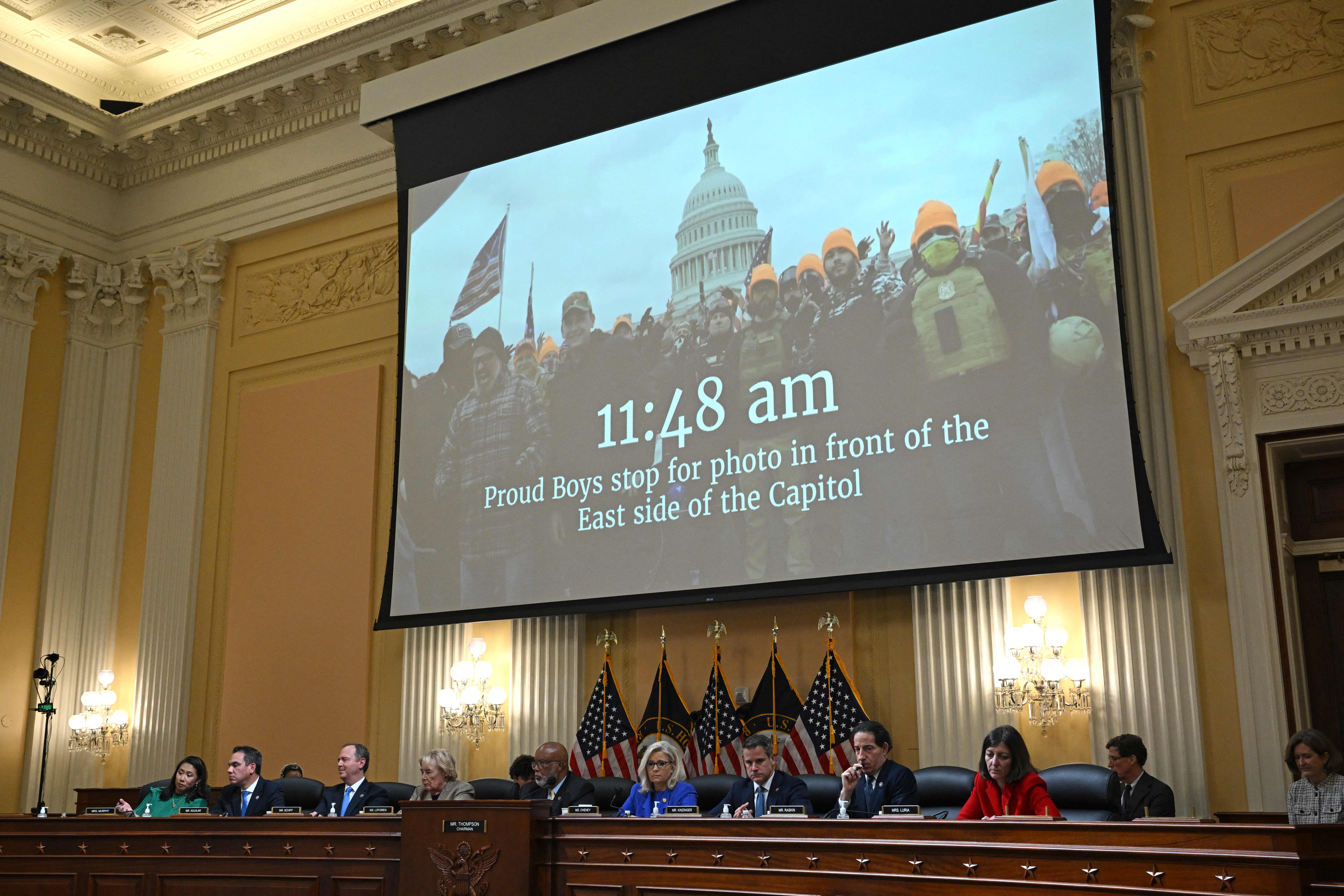 TOPSHOT - A video showing Proud Boys members appear on screen during a House Select Committee hearing to Investigate the January 6th Attack on the US Capitol, in the Cannon House Office Building on Capitol Hill in Washington, DC on June 9, 2022. (Photo by MANDEL NGAN / AFP) (Photo by MANDEL NGAN/AFP via Getty Images)