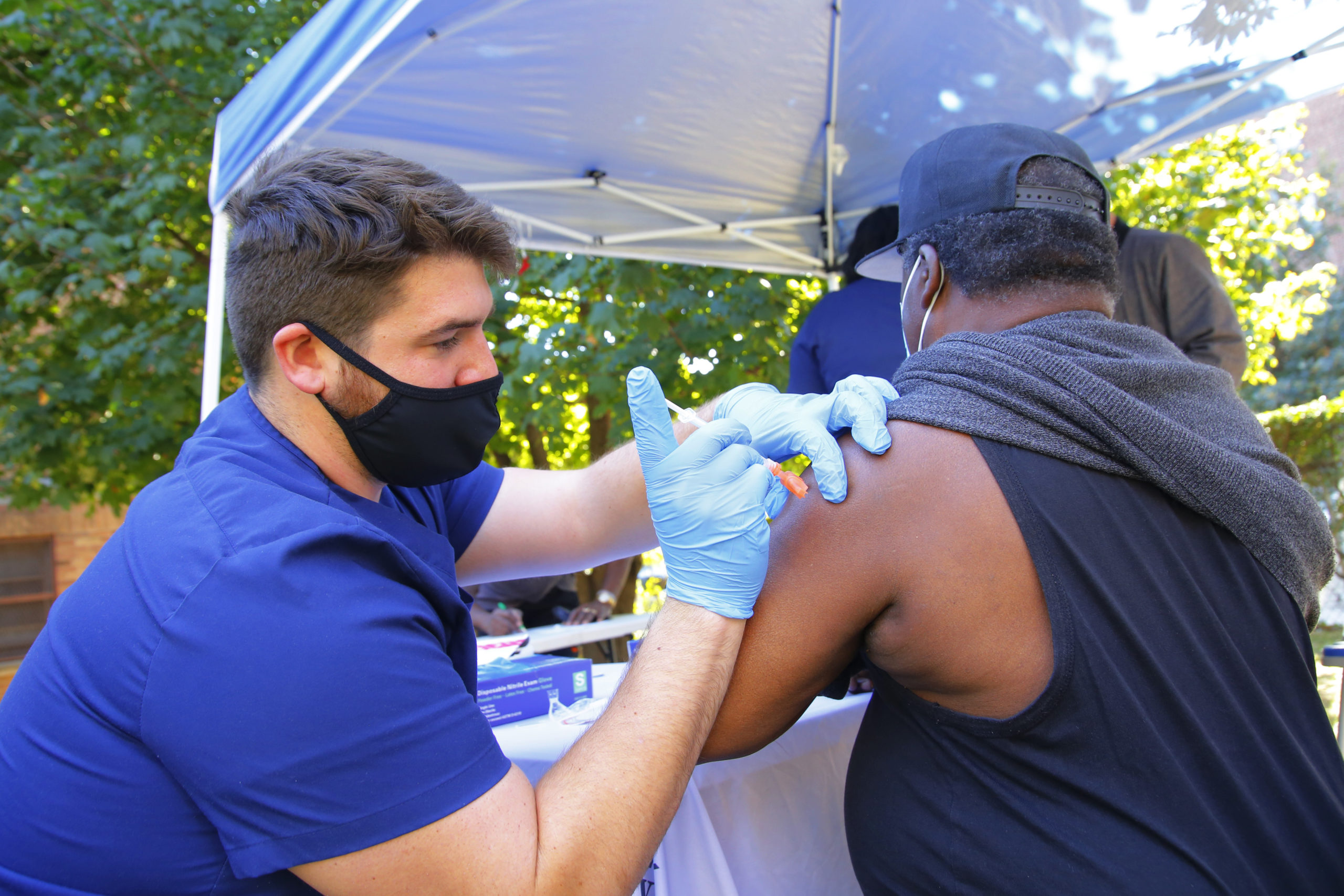 A VIP StarNETWORK medical staff member administers a Pfizer-BioNTech coronavirus (COVID-19) vaccine at a #VAXTOSCHOOL pop-up site at Life of Hope Center on October 21, 2021 in New York City. Gov. Kathy Hochul announced yesterday the opening of 25 new coronavirus (COVID-19) vaccination pop-up sites in an initiative to help increase vaccination rates among school-aged New Yorkers. The Department of Health is working alongside local county health departments, community-based organizations, and healthcare centers to install these sites in different regions of the state. According to the state COVID-19 vaccine tracker, since October 18, 62 percent of 12 to 15-year-olds and 72 percent of 16 to 25-year-olds have received at least one coronavirus vaccine dose. (Photo by Michael M. Santiago/Getty Images)