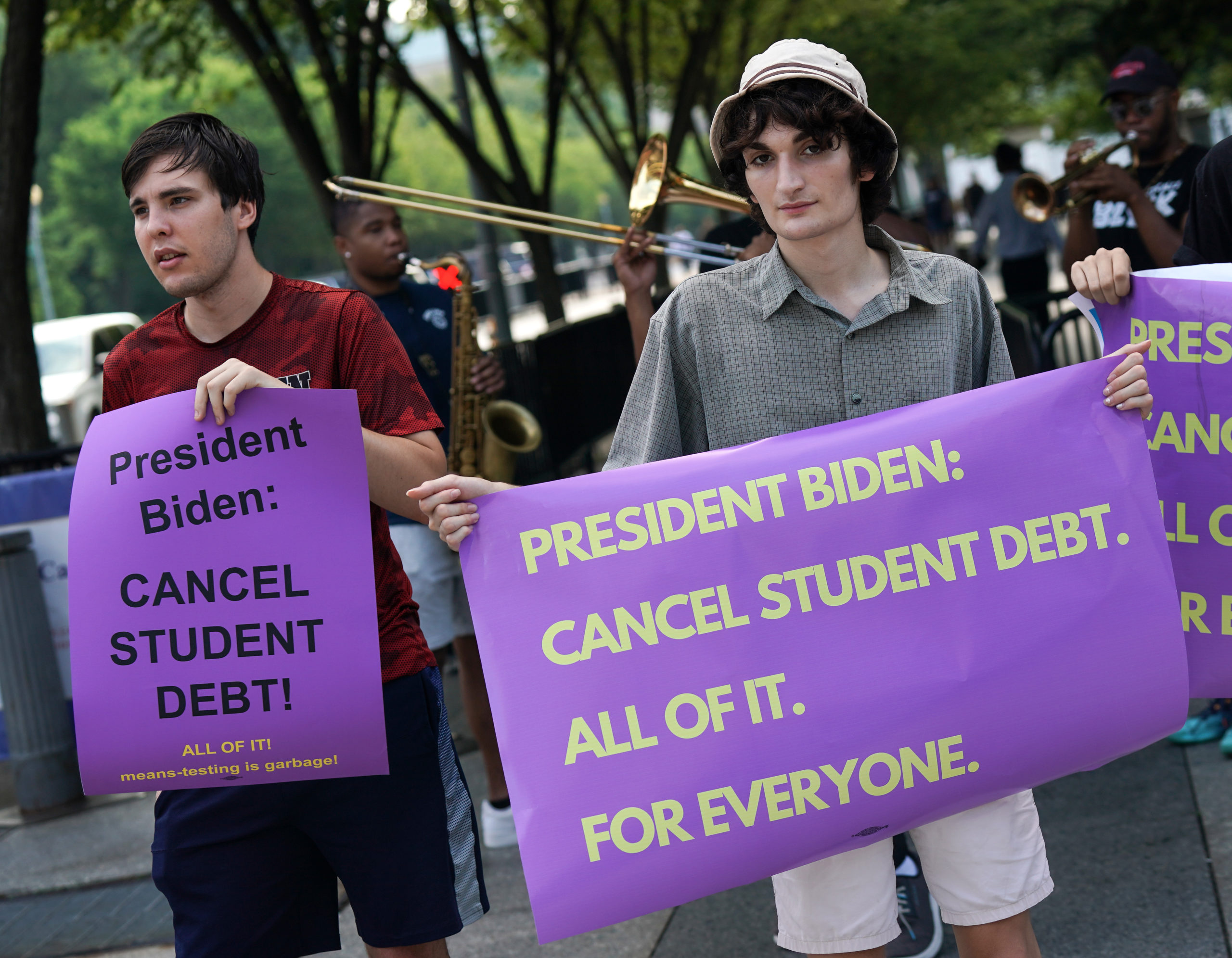 Student loan debt holders take part in a demonstration outside of the white house staff entrance to demand that President Biden cancel student loan debt in August on July 27, 2022 at the Executive Offices in Washington, DC. (Photo by Jemal Countess/Getty Images for We, The 45 Million)