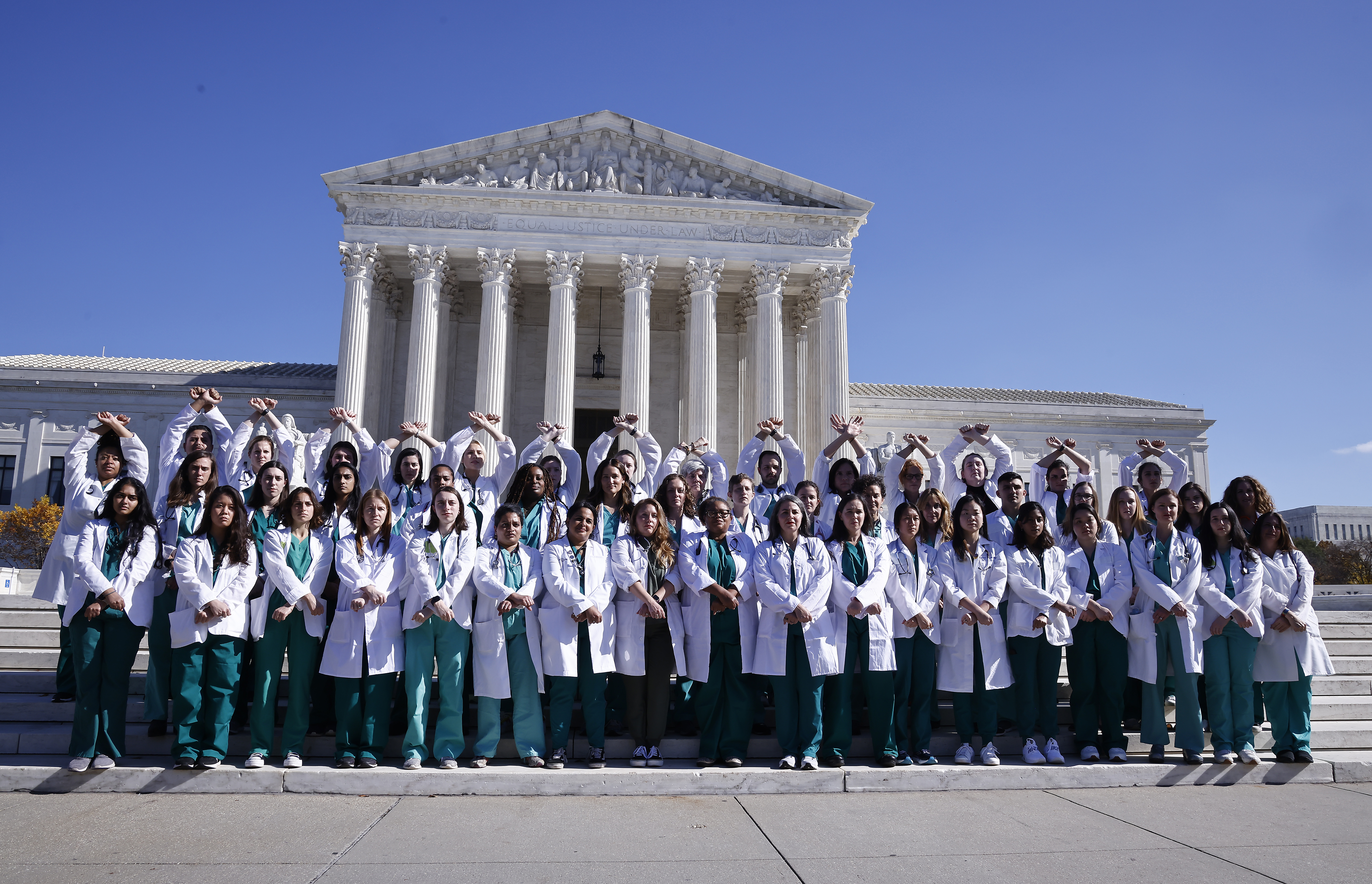 WASHINGTON, DC - NOVEMBER 03: Doctors from across the U.S. stop at the U.S. Supreme Court during an action to protect abortion access and demand an end to the current and future criminalization of providers who perform lifesaving abortion care on November 03, 2022 in Washington, DC. (Photo by Paul Morigi/Getty Images for Doctors for Abortion Action)