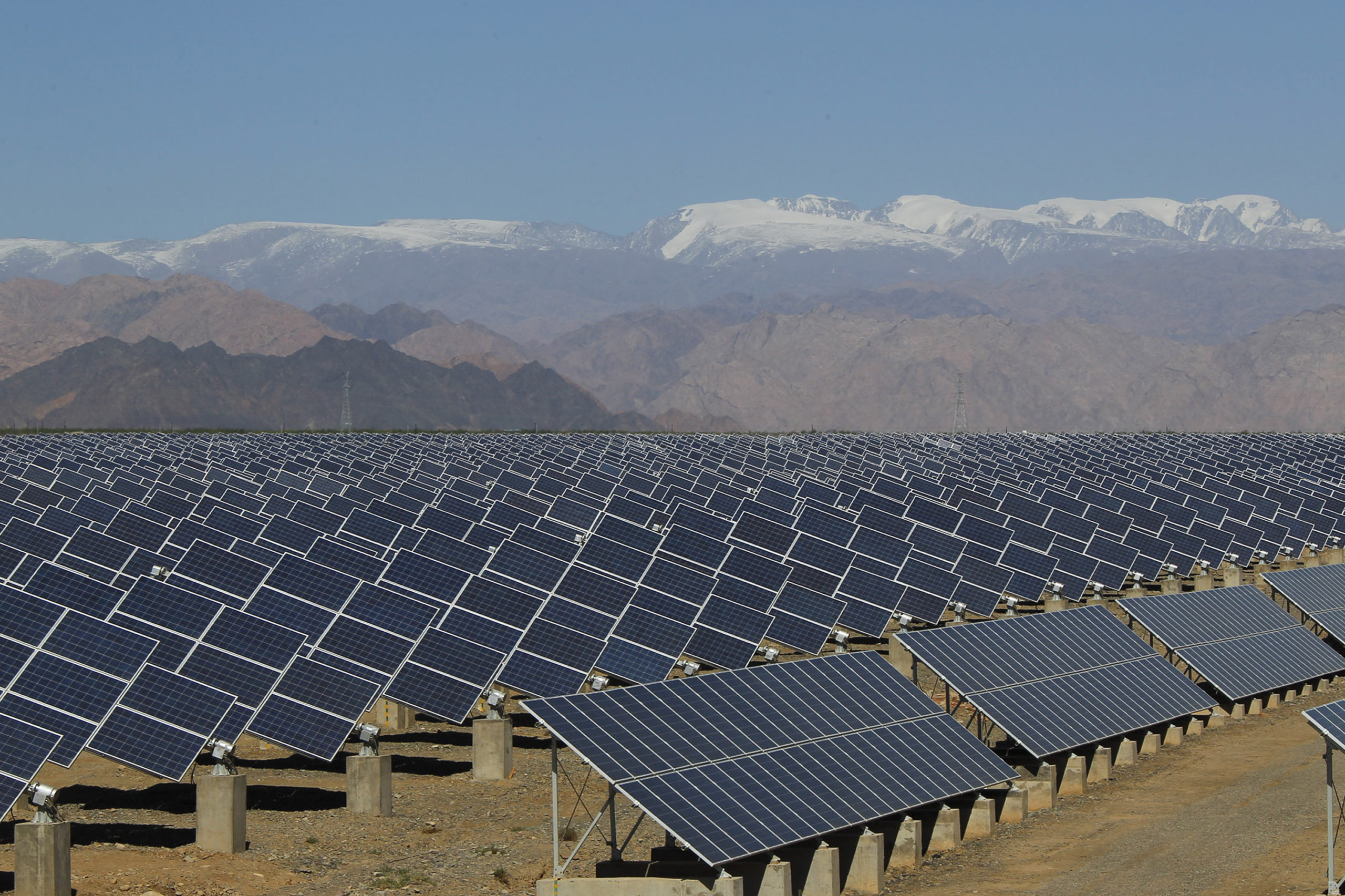 Large solar panels are seen in a solar power plant in Hami, northwest China's Xinjiang Uygur Autonomous Region on May 8, 2013. 