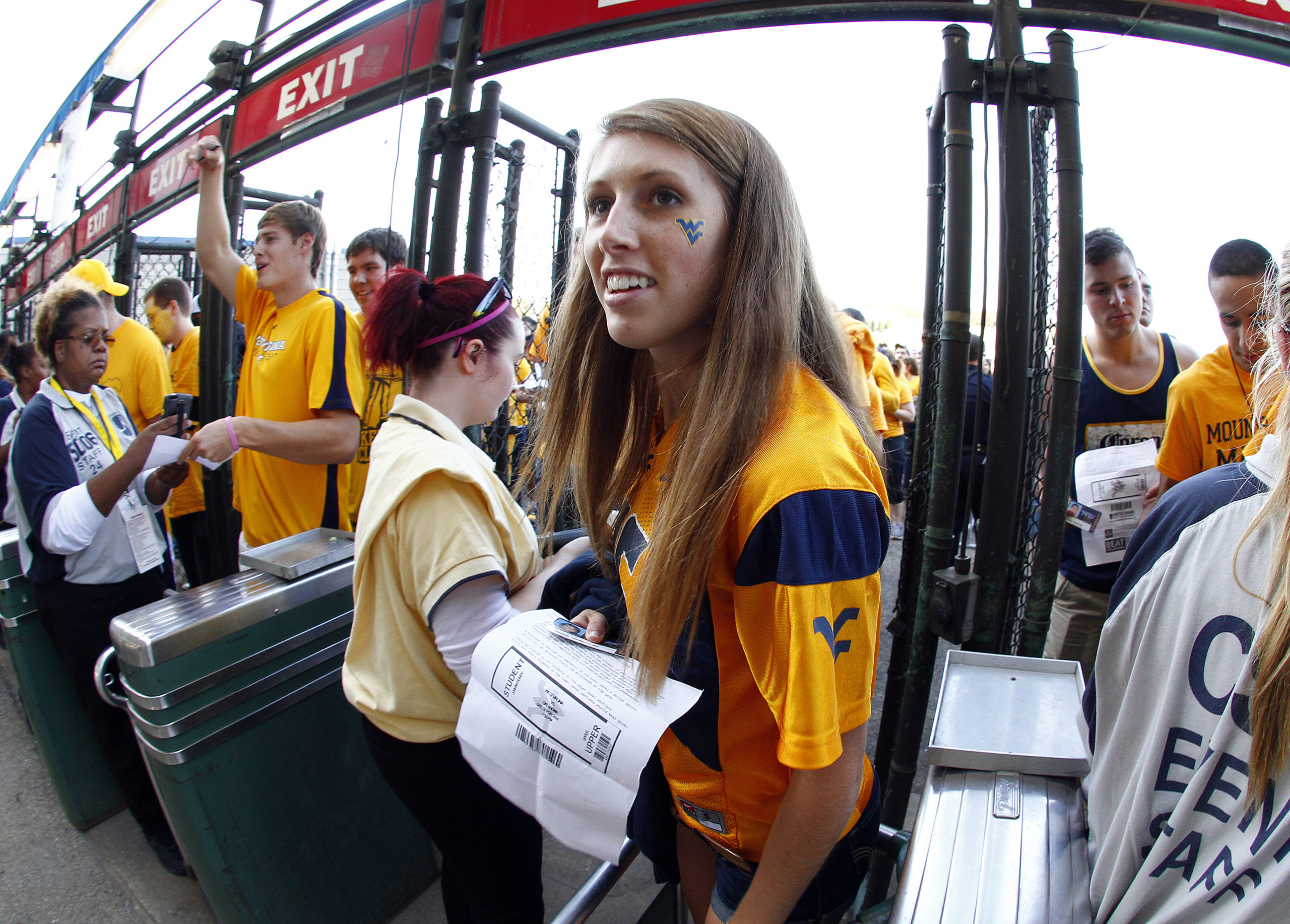 A WVU student enters the stadium before the game between the Oklahoma Sooners and the West Virginia Mountaineers on September 20, 2014 at Mountaineer Field in Morgantown, West Virginia. (Photo by Justin K. Aller/Getty Images)